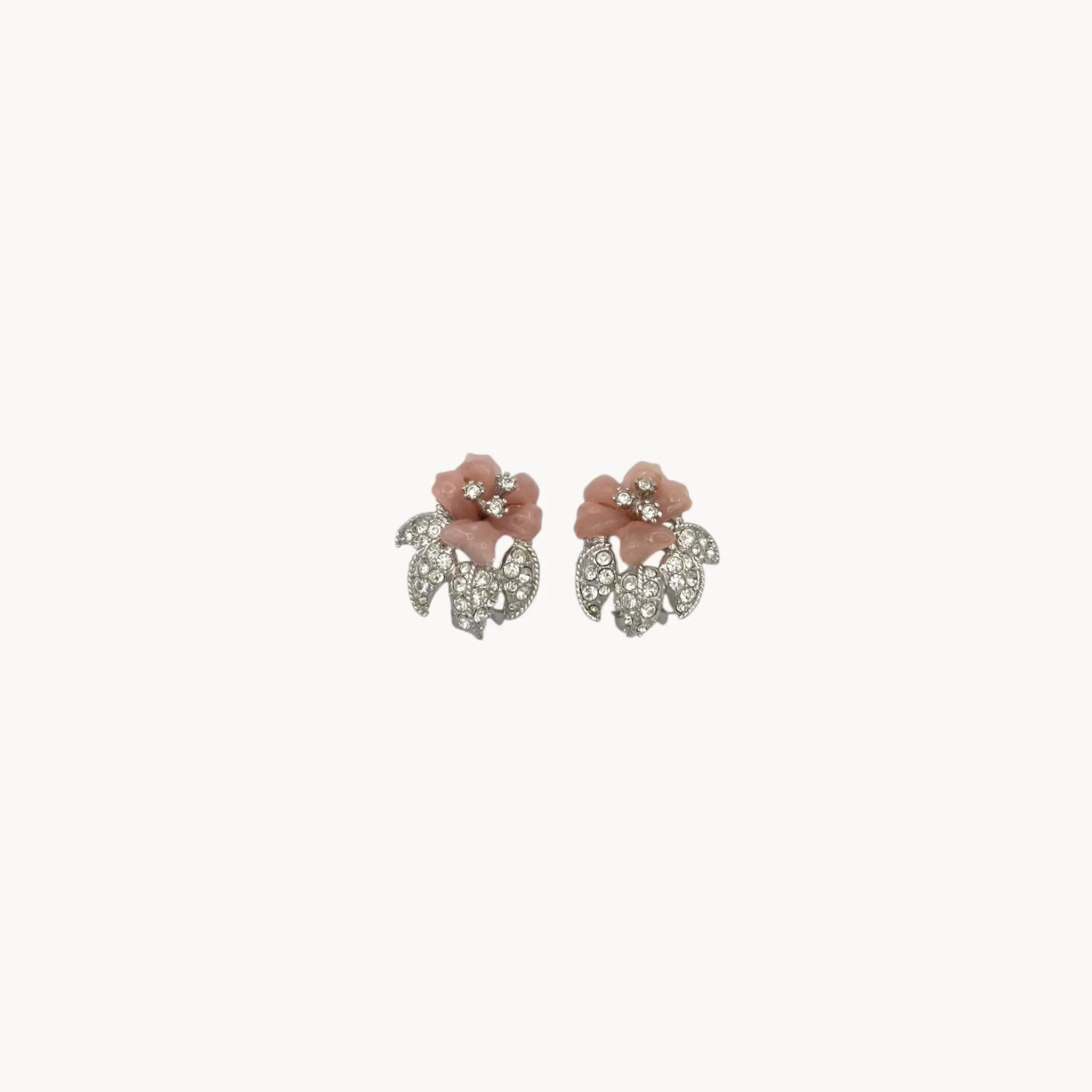 Nolan Miller vintage pink flower clip-on earrings with rhinestone accents and silver-tone leaves
