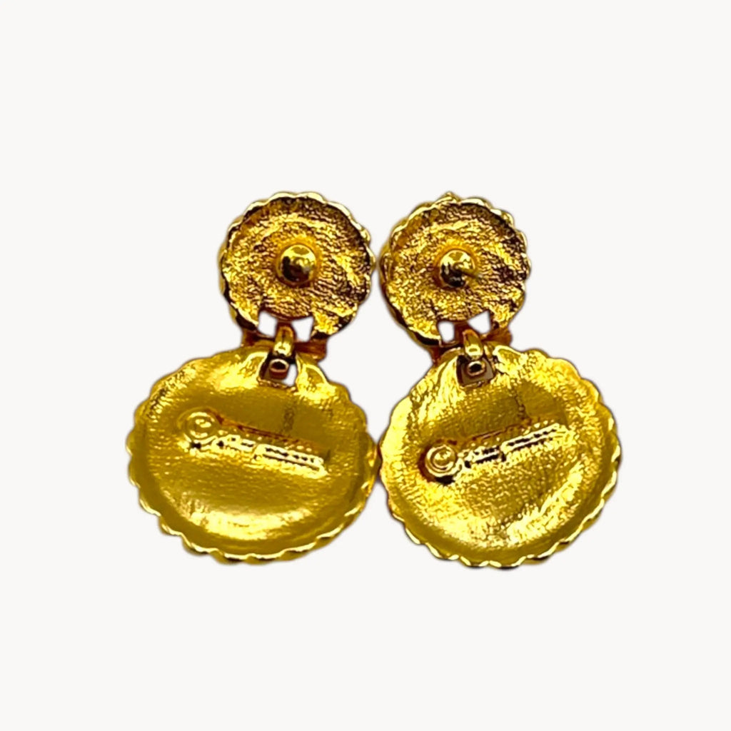 Back view of Vintage Paquette gold rope dangle earrings with faux pearls on white background.