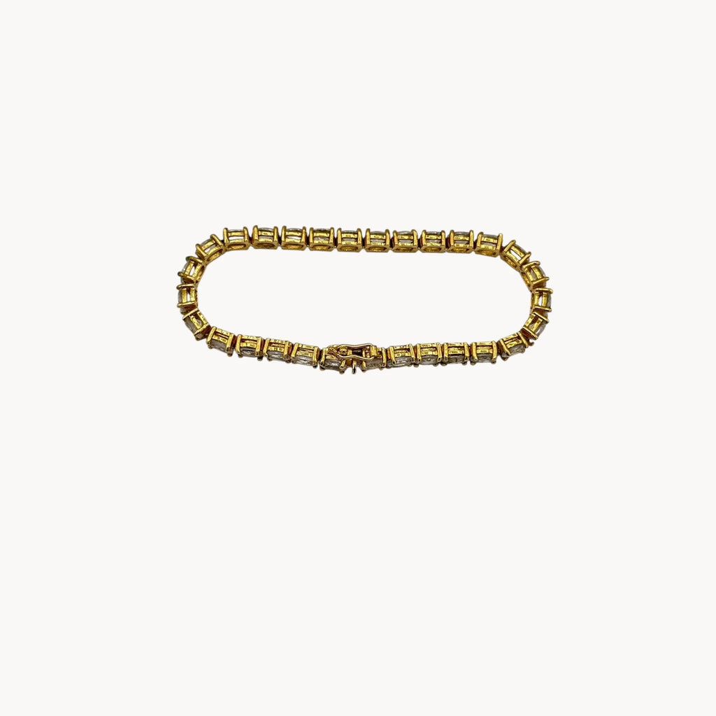 Top view of Sterling silver vermeil CZ tennis bracelet with brilliant round stones, vintage bridal and evening jewelry.