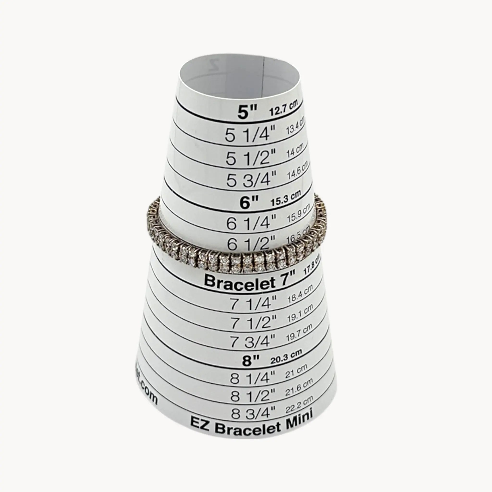 On sizer view of Sterling silver vermeil gold plated two row CZ tennis bracelet.