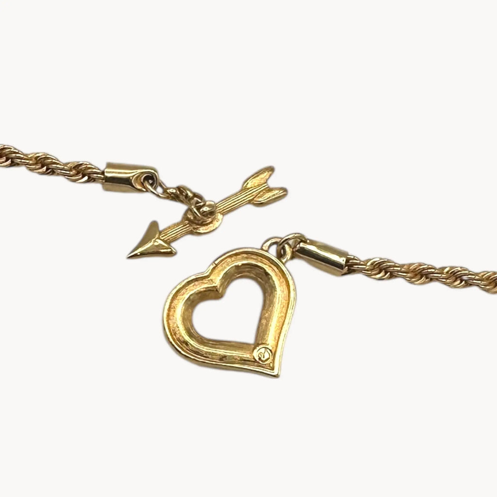 Back close up view of pendant of Swarovski gold rope chain necklace with pave heart toggle clasp.