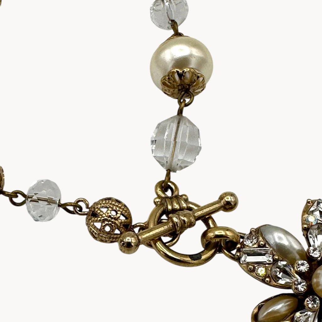 Close up of clasp of Sweet Romance floral charm bracelet with pearls and rhinestones