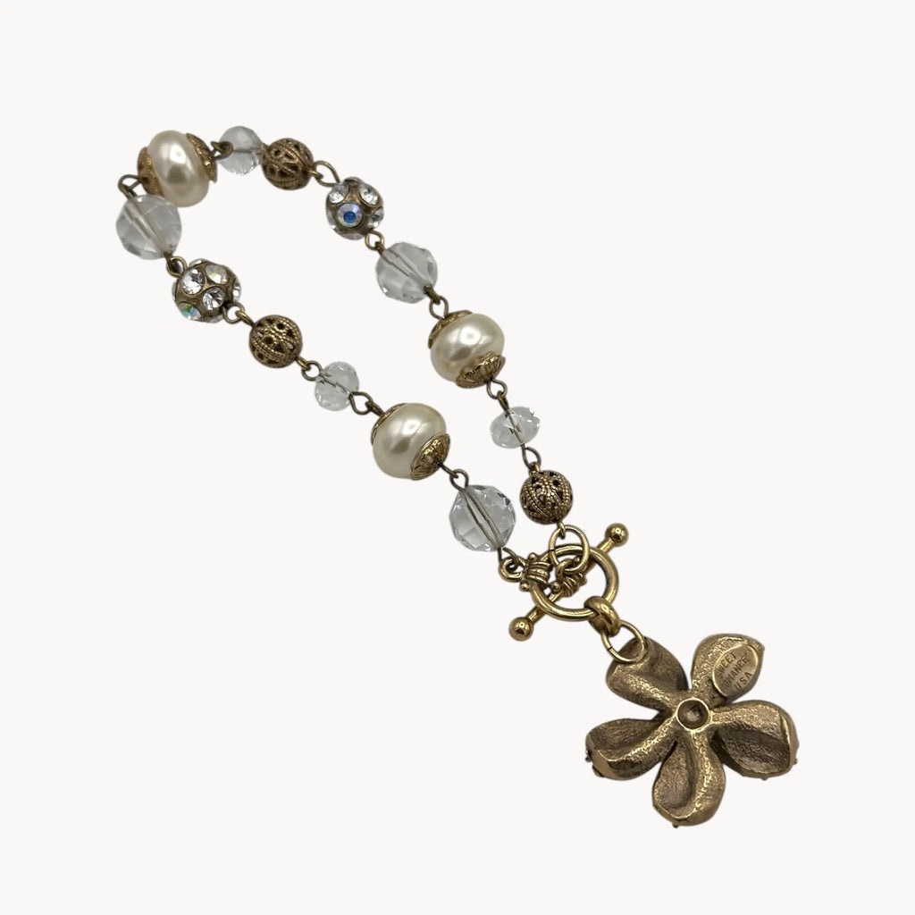 Back view of Sweet Romance floral charm bracelet with pearls and rhinestones