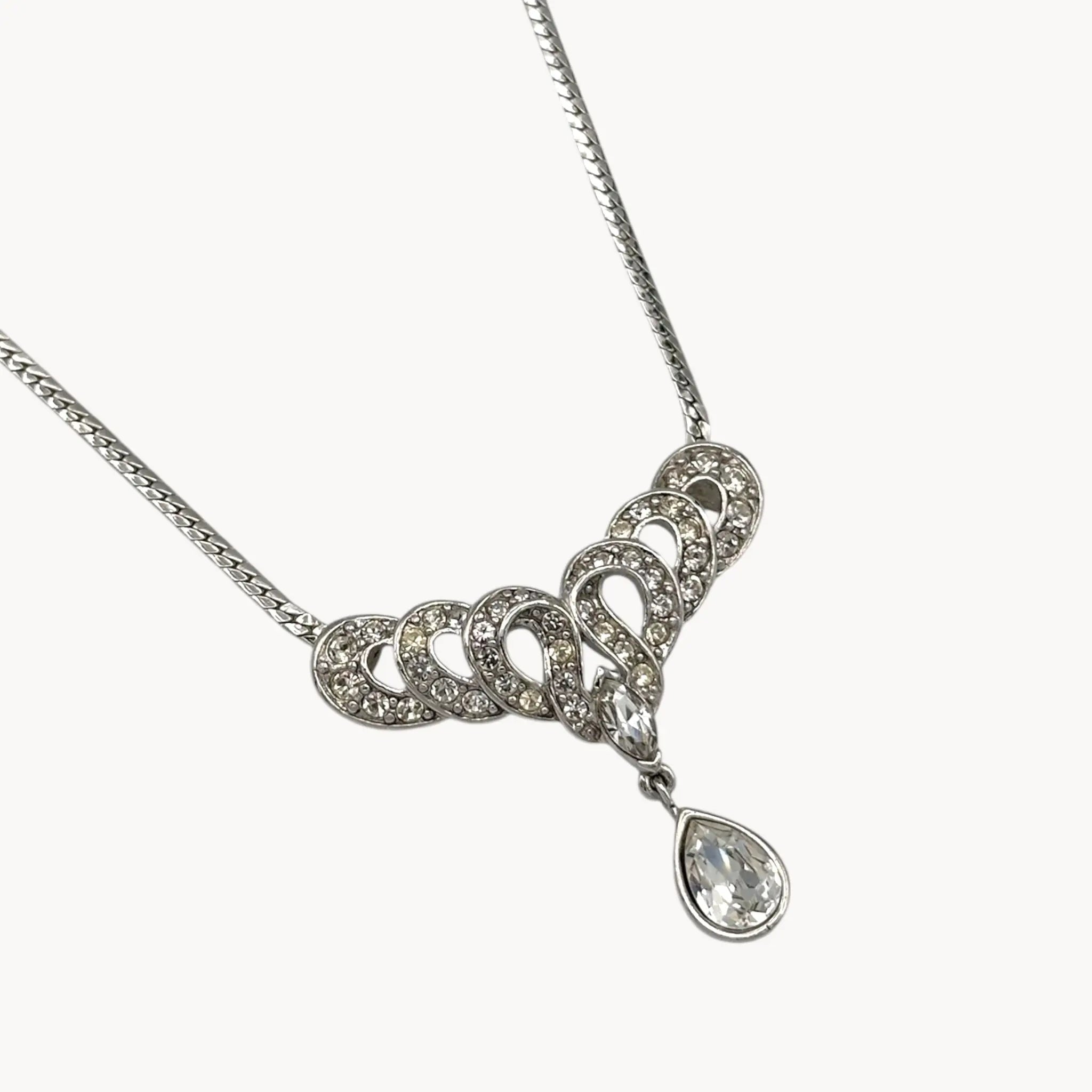 Close up view of pendant Trifari 1980s rhinestone necklace with teardrop centerpiece, vintage bridal jewelry