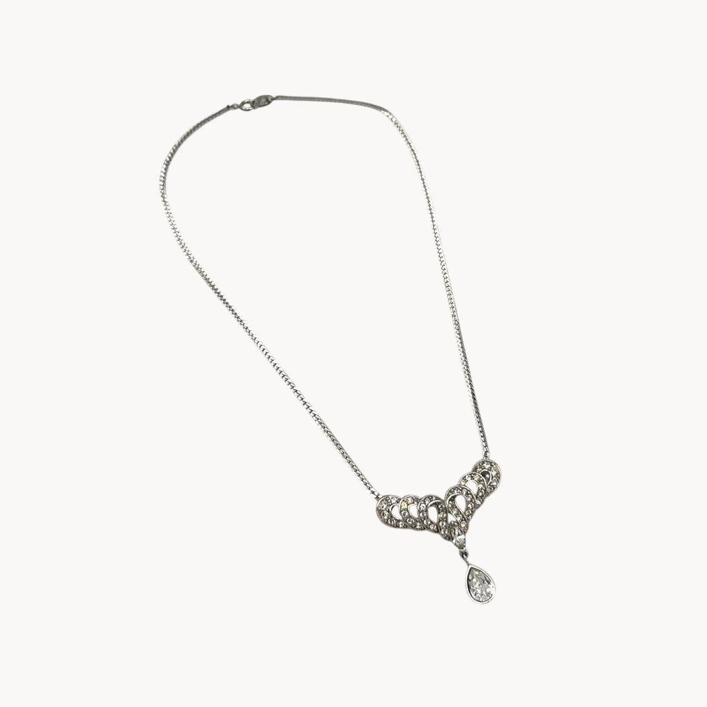 Against white background Trifari 1980s rhinestone necklace with teardrop centerpiece, vintage bridal jewelry