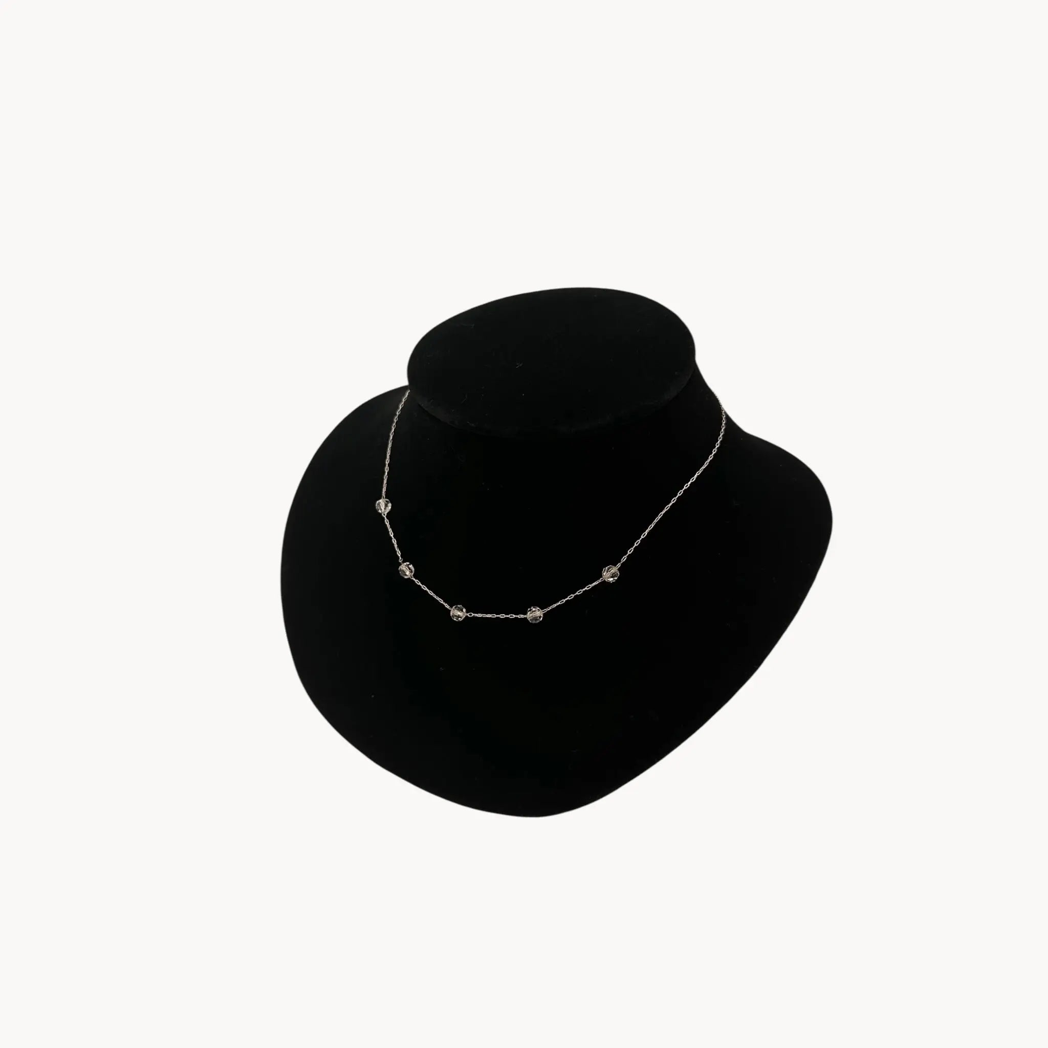 Side view of Van Dell sterling silver crystal station necklace, mid-century vintage jewelry.