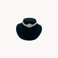 Art Deco crystal necklace on black bust.