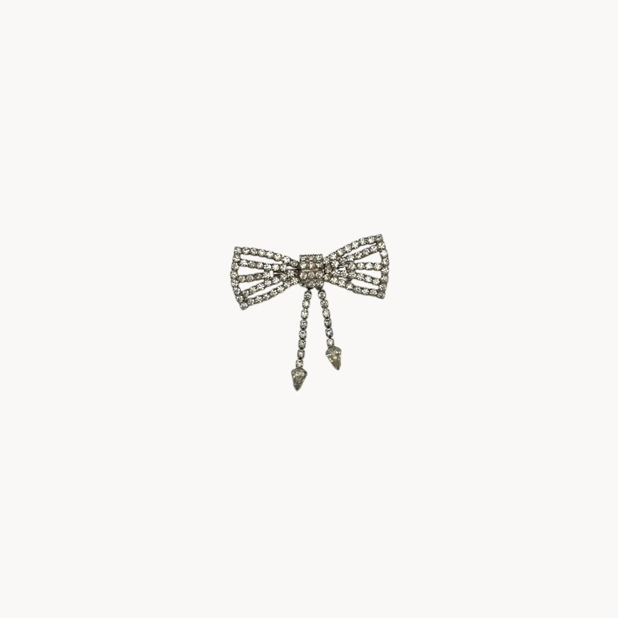 Vintage Art Deco style rhinestone bow brooch with dangle drops.