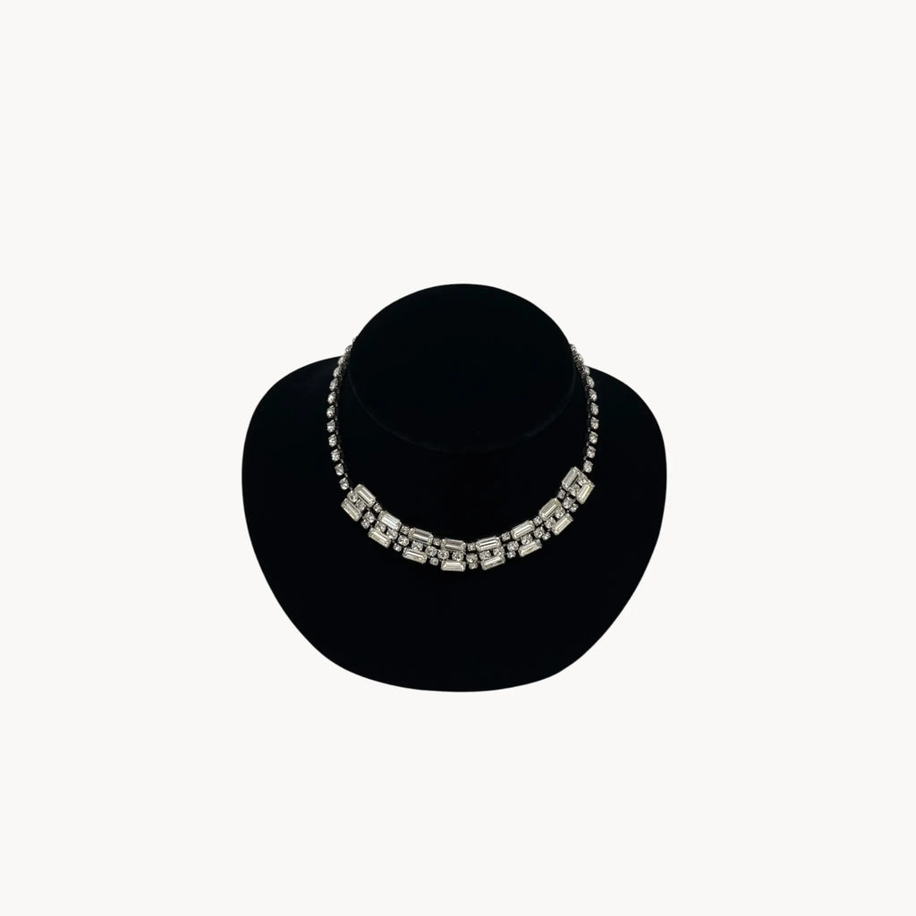 Close up view of Vintage Art Deco style rhinestone choker necklace with baguette and round stones, unmarked 1950s bridal jewelry