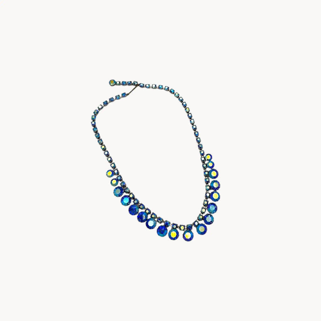 On white “Vintage unmarked blue aurora borealis rhinestone necklace, 1950s–1960s mid-century bridal jewelry.