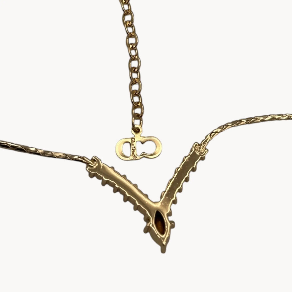 Bak view Vintage Christian Dior necklace with gold-tone chain and V-shaped crystal pendant, 1990s bridal jewelry.