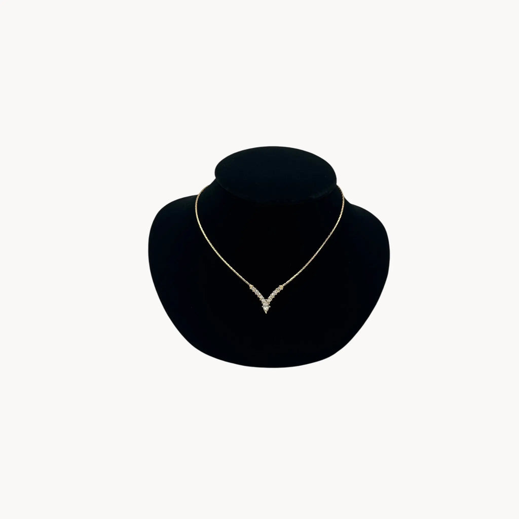 Vintage Christian Dior necklace with gold-tone chain and V-shaped crystal pendant, 1990s bridal jewelry.