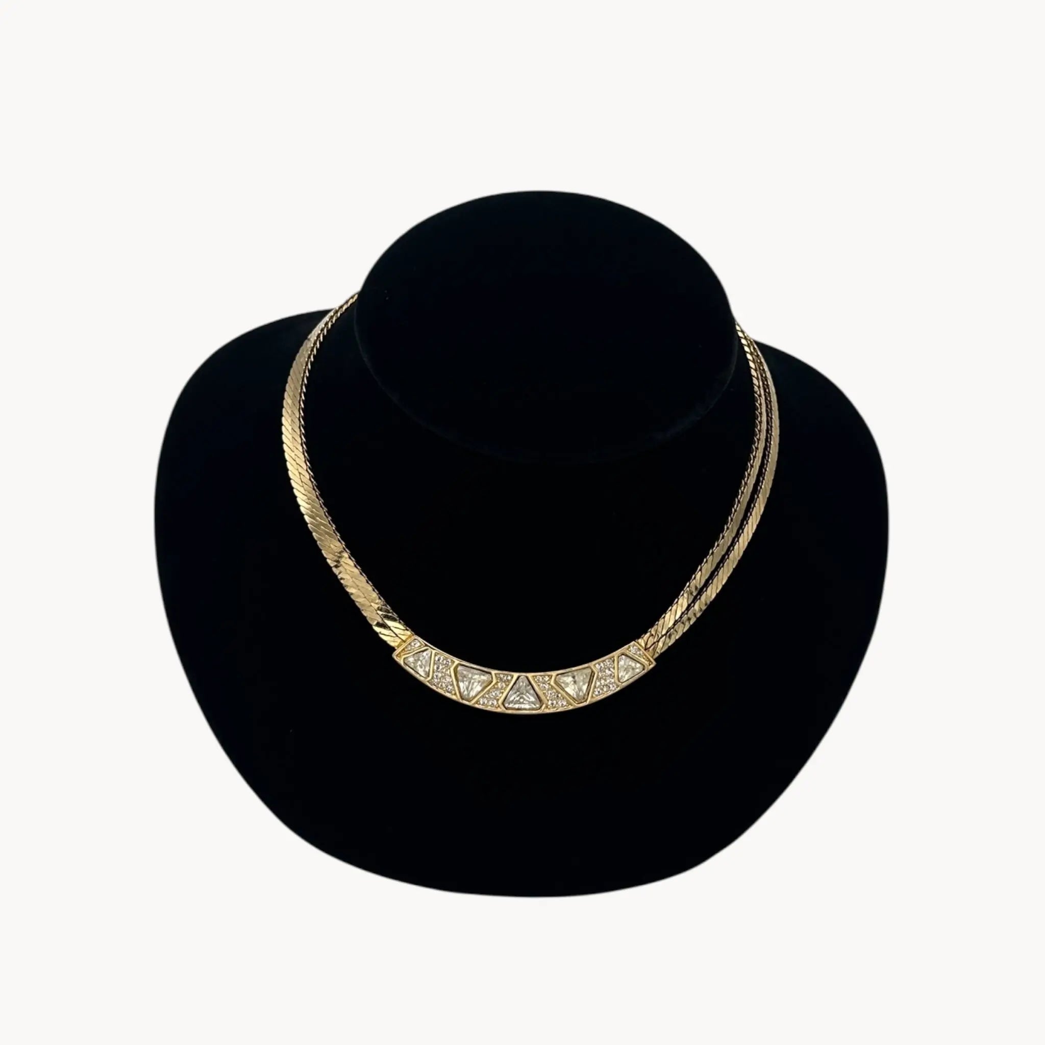 Close up Vintage Christian Dior gold collar necklace with pavé crystal geometric accents, 1980s bridal statement jewelry.