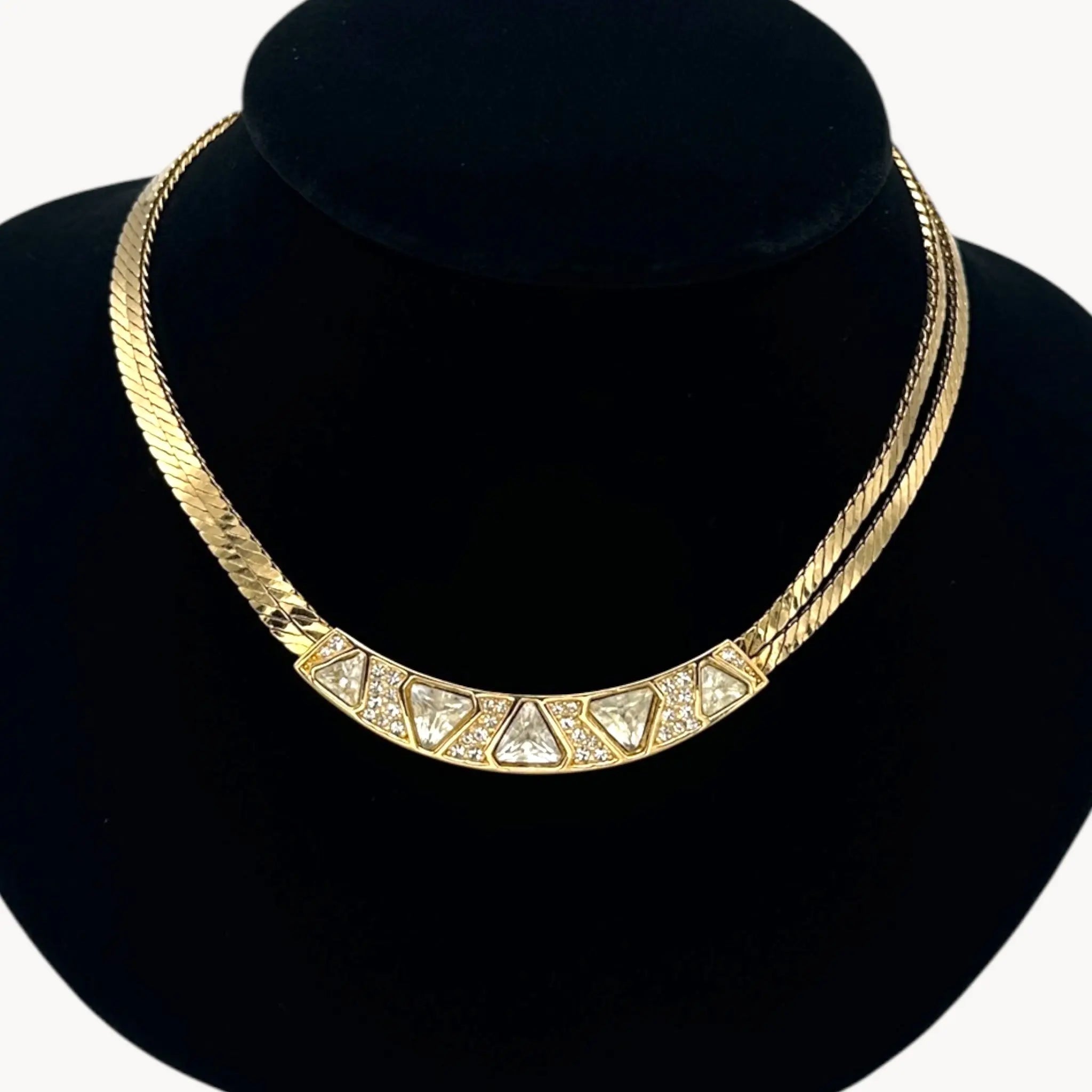 Close up of pendant Vintage Christian Dior gold collar necklace with pavé crystal geometric accents, 1980s bridal statement jewelry.