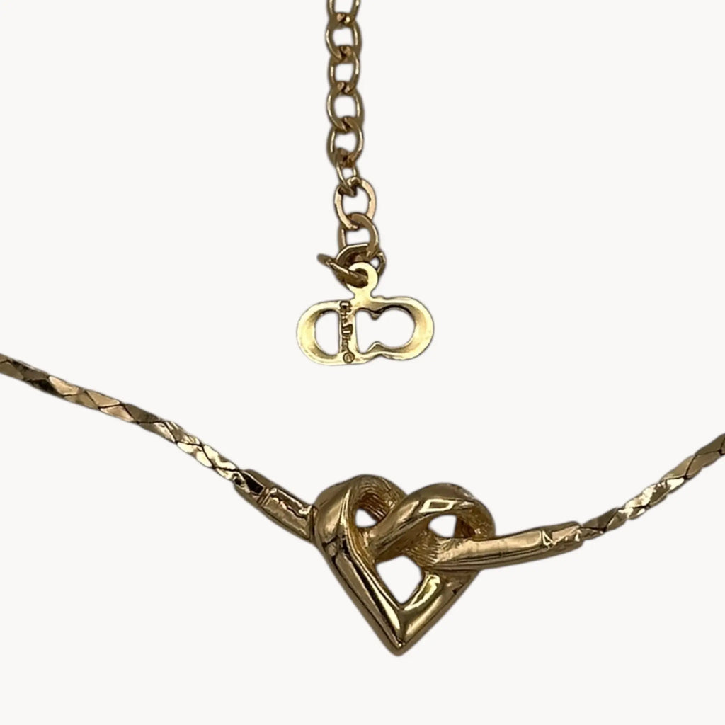 Back view of Vintage Christian Dior gold heart pendant necklace with rhinestone detail.