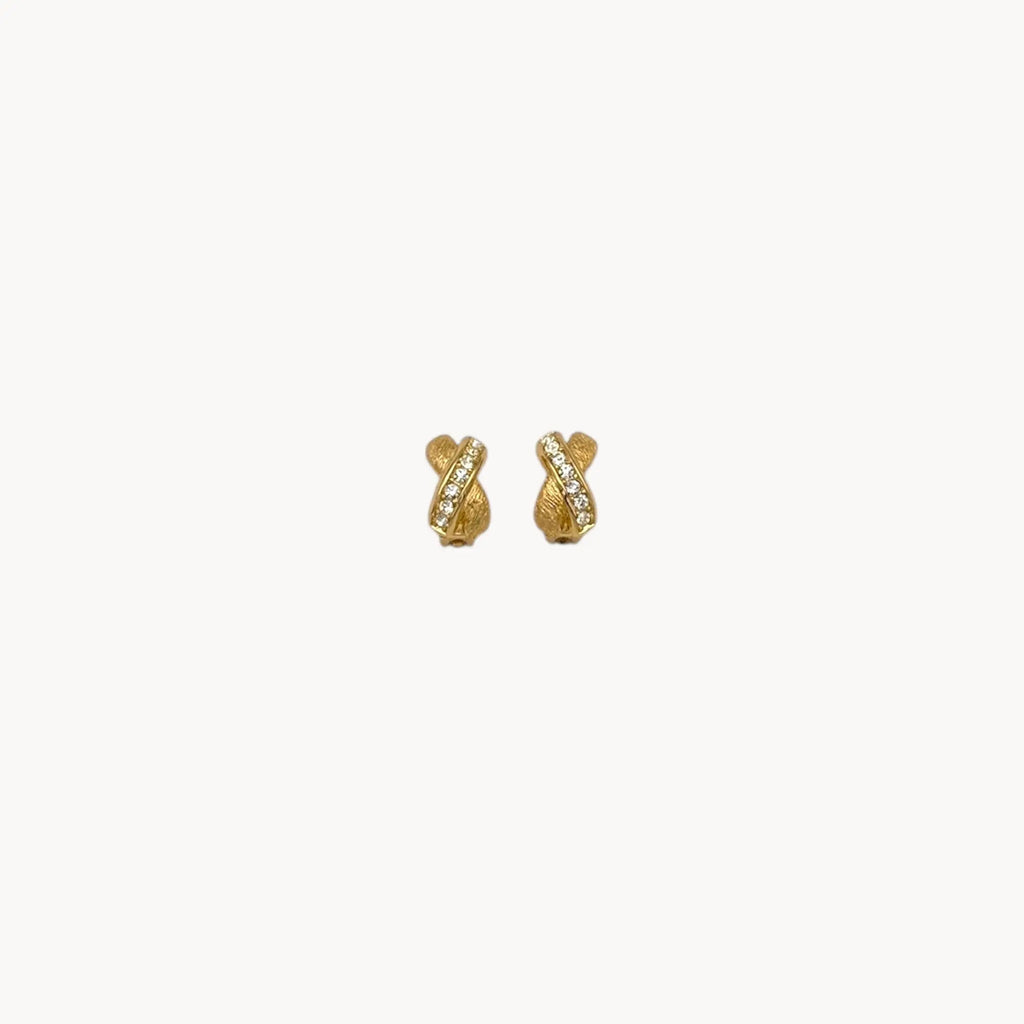 Vintage Christian Dior petite gold-tone clip-on earrings with rhinestone ribbon detail.