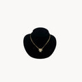 Vintage Christian Dior necklace with gold-tone chain and starburst pendant featuring pearl center and crystal accents, 1980s bridal jewelry.