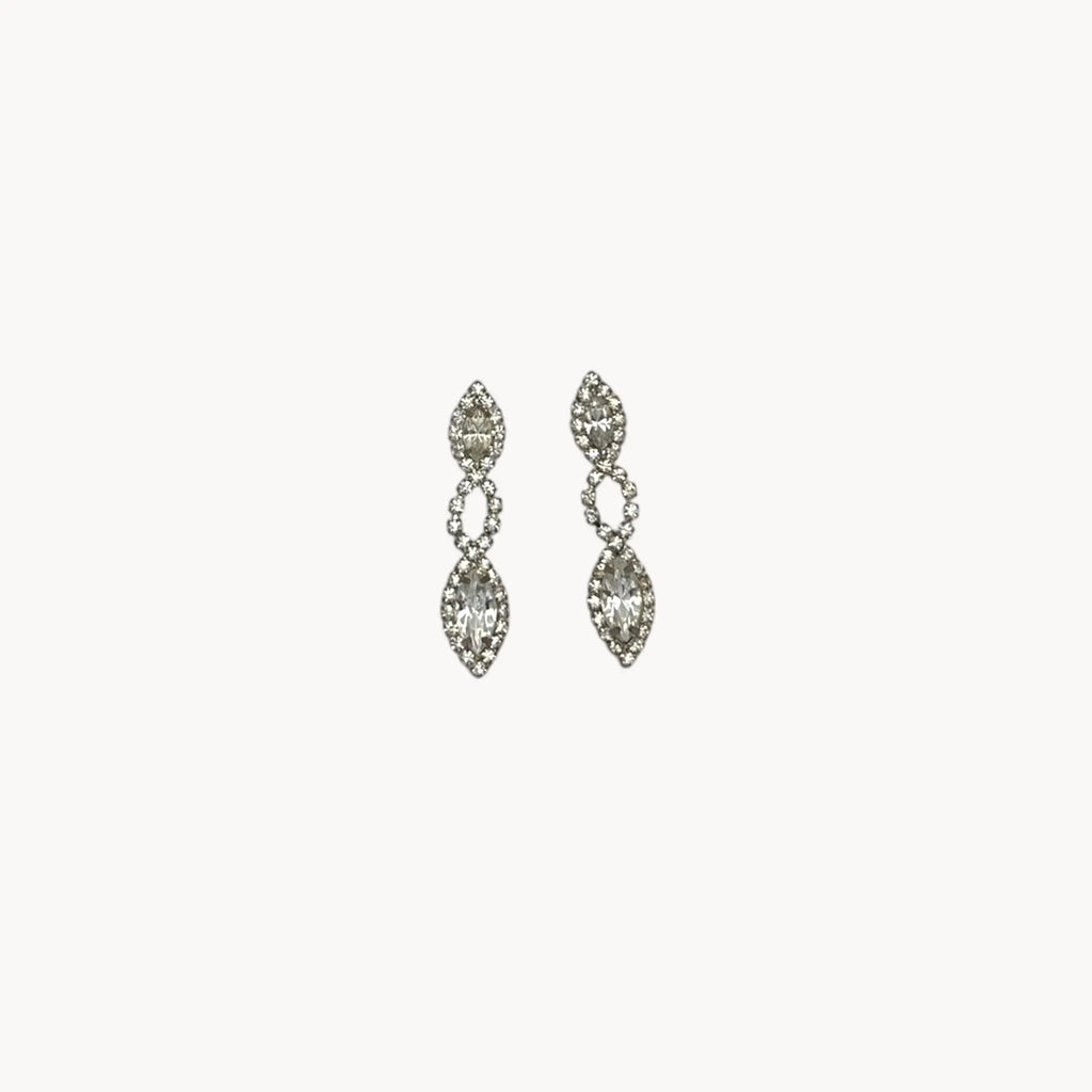 Close up view of Vintage clear rhinestone dangle pierced earrings with marquise stones, bridal jewelry.