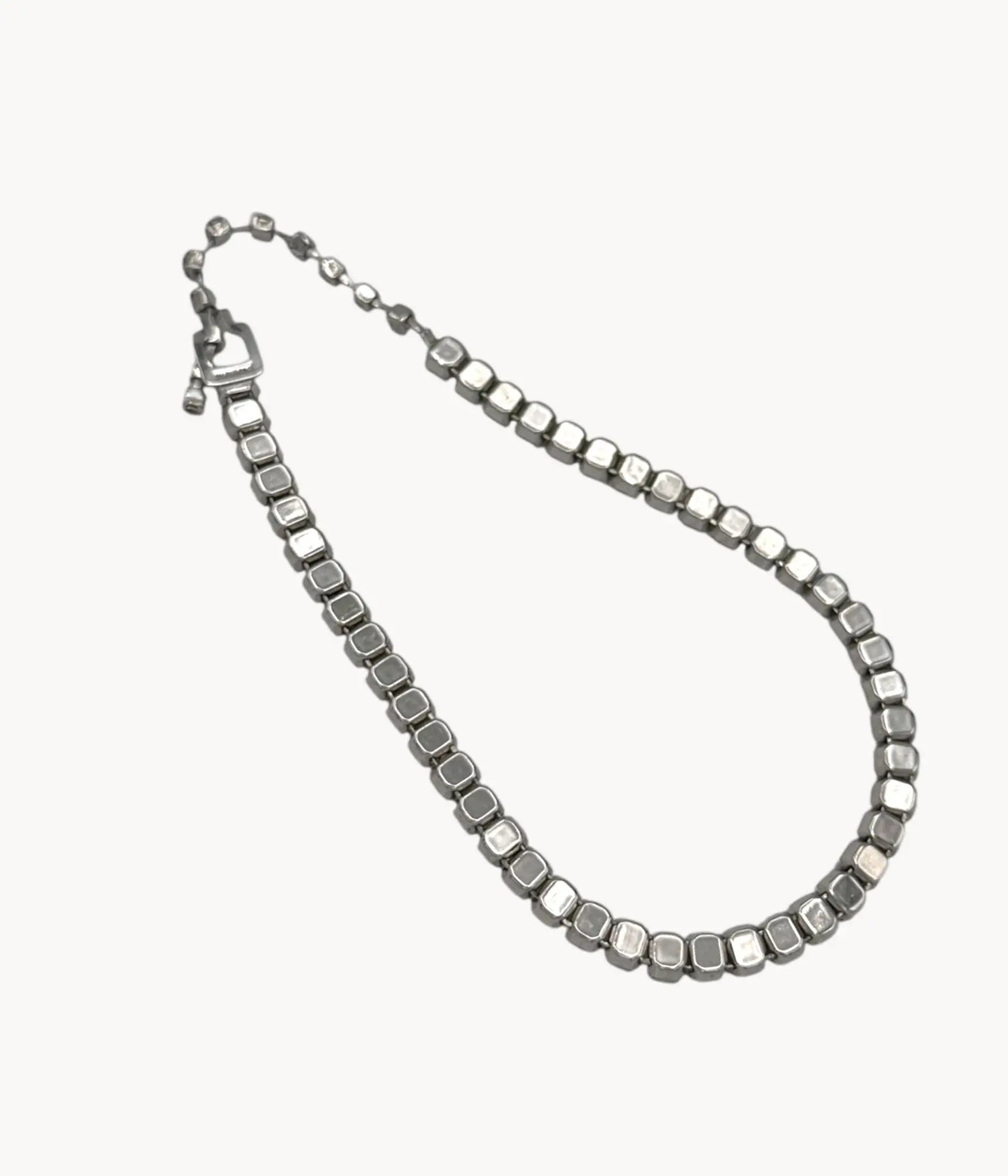 Back view of Eisenberg Rhinestone vintage necklace against a white background.