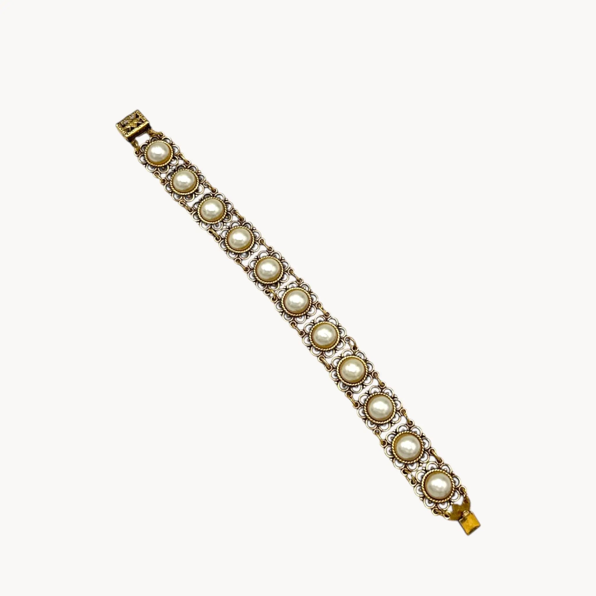 Vintage Faux Pearl & Gold Filigree Bracelet on white background.