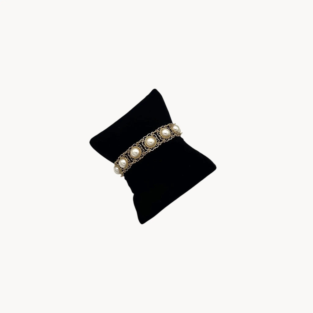 Vintage Faux Pearl & Gold Filigree Bracelet on black pillow.