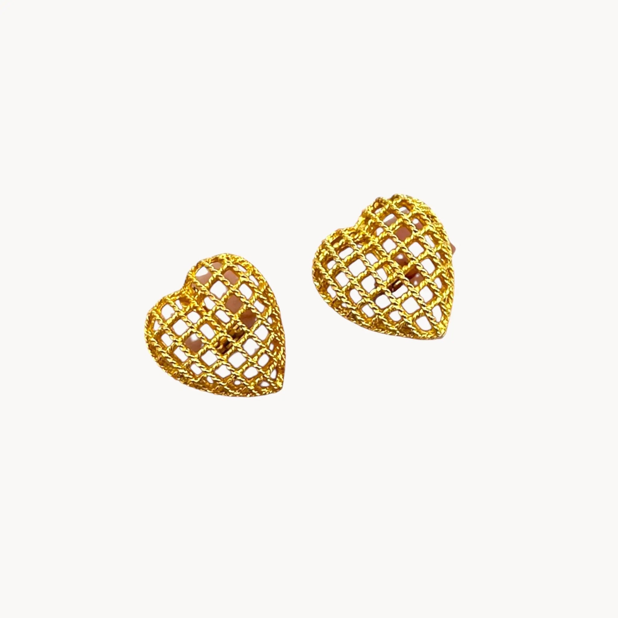 Earrings of Vintage gold caged pearl heart bracelet and matching clip-on earrings set, 1980s–1990s jewelry on white background.