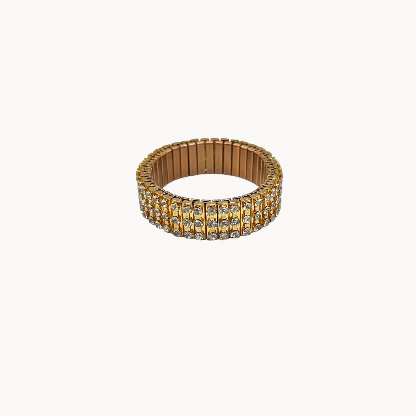Inside view of Vintage gold-tone expansion bracelet with three rows of rhinestones, mid-century design.