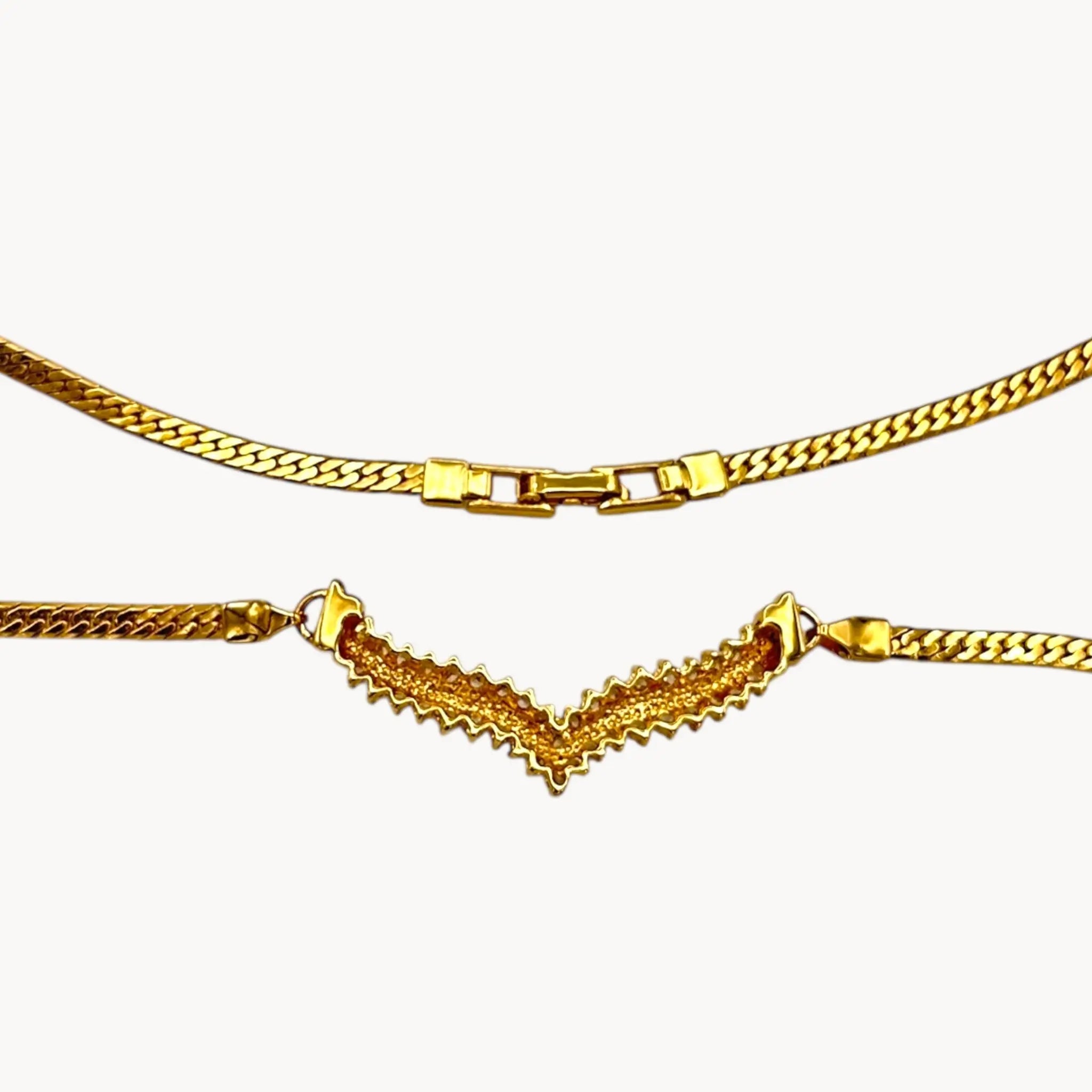 Back view of Vintage gold rhinestone chevron necklace from the 1980s–1990s on white background.