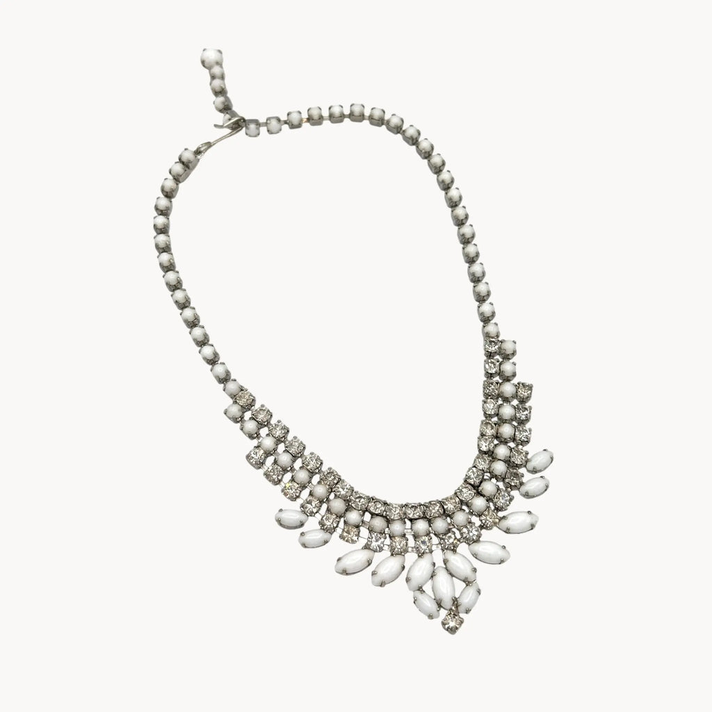 on white background Vintage Joseph Warner rhinestone necklace with tiered clear crystals and white marquise accents, 1950s–1960s bridal statement jewelry.