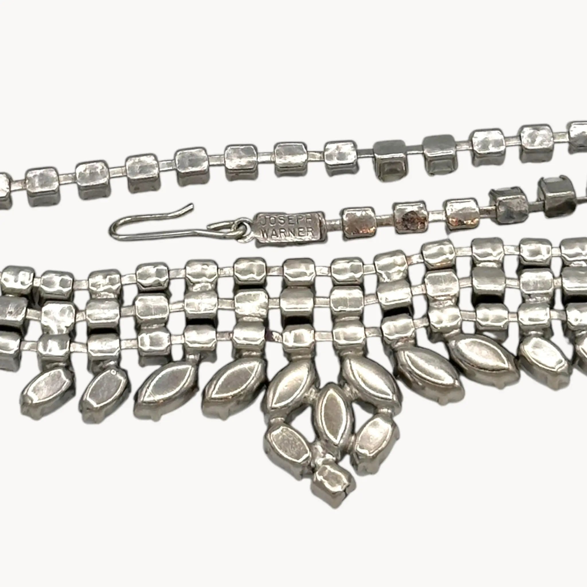 Back view Vintage Joseph Warner rhinestone necklace with tiered clear crystals and white marquise accents, 1950s–1960s bridal statement jewelry.