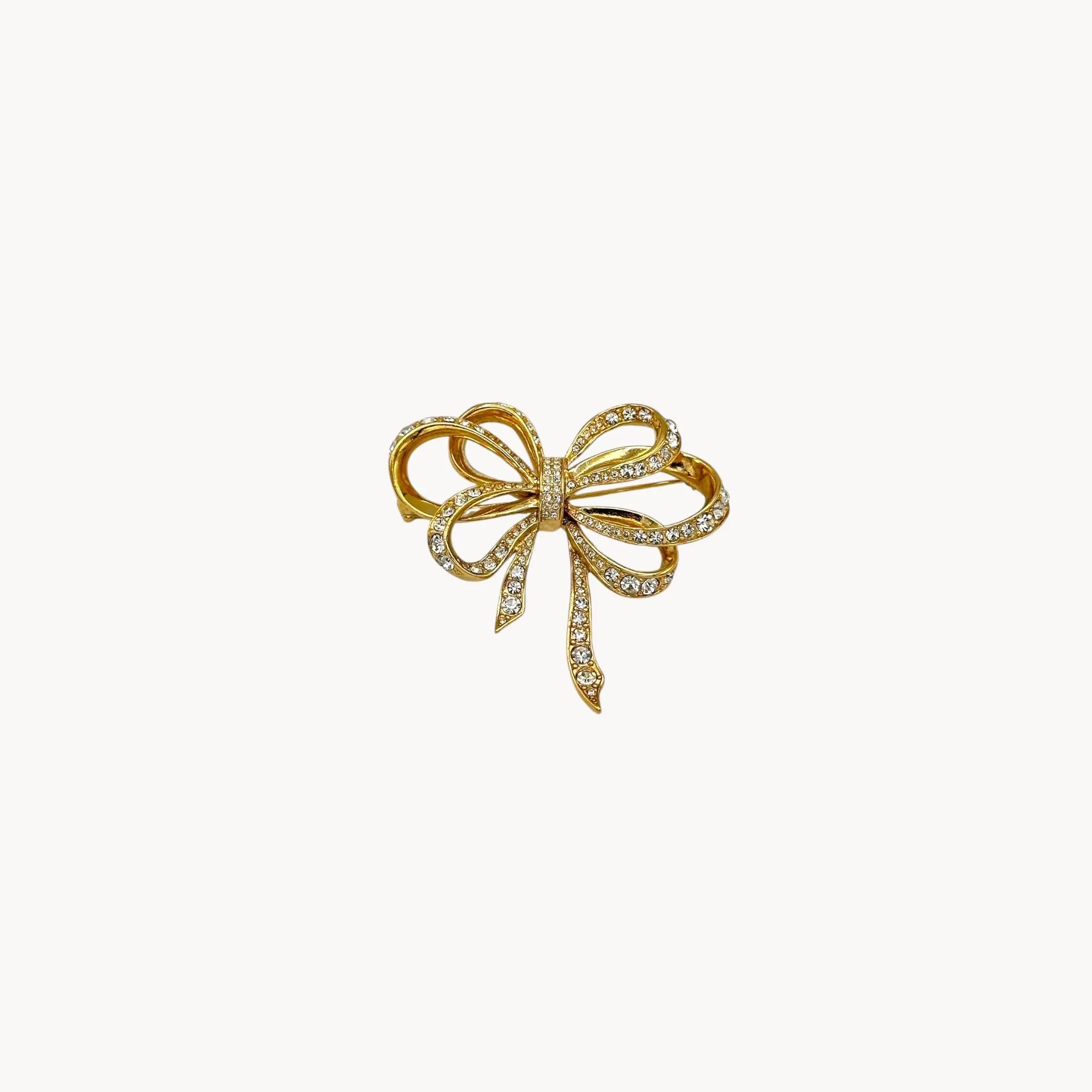 Vintage Kenneth Jay Lane gold and crystal pavé bow brooch.