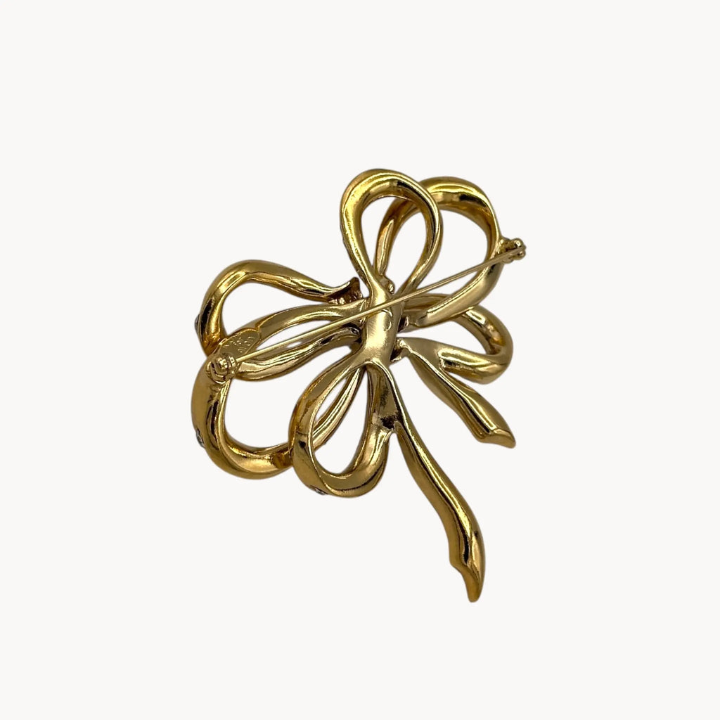 Back view Vintage Kenneth Jay Lane gold and crystal pavé bow brooch