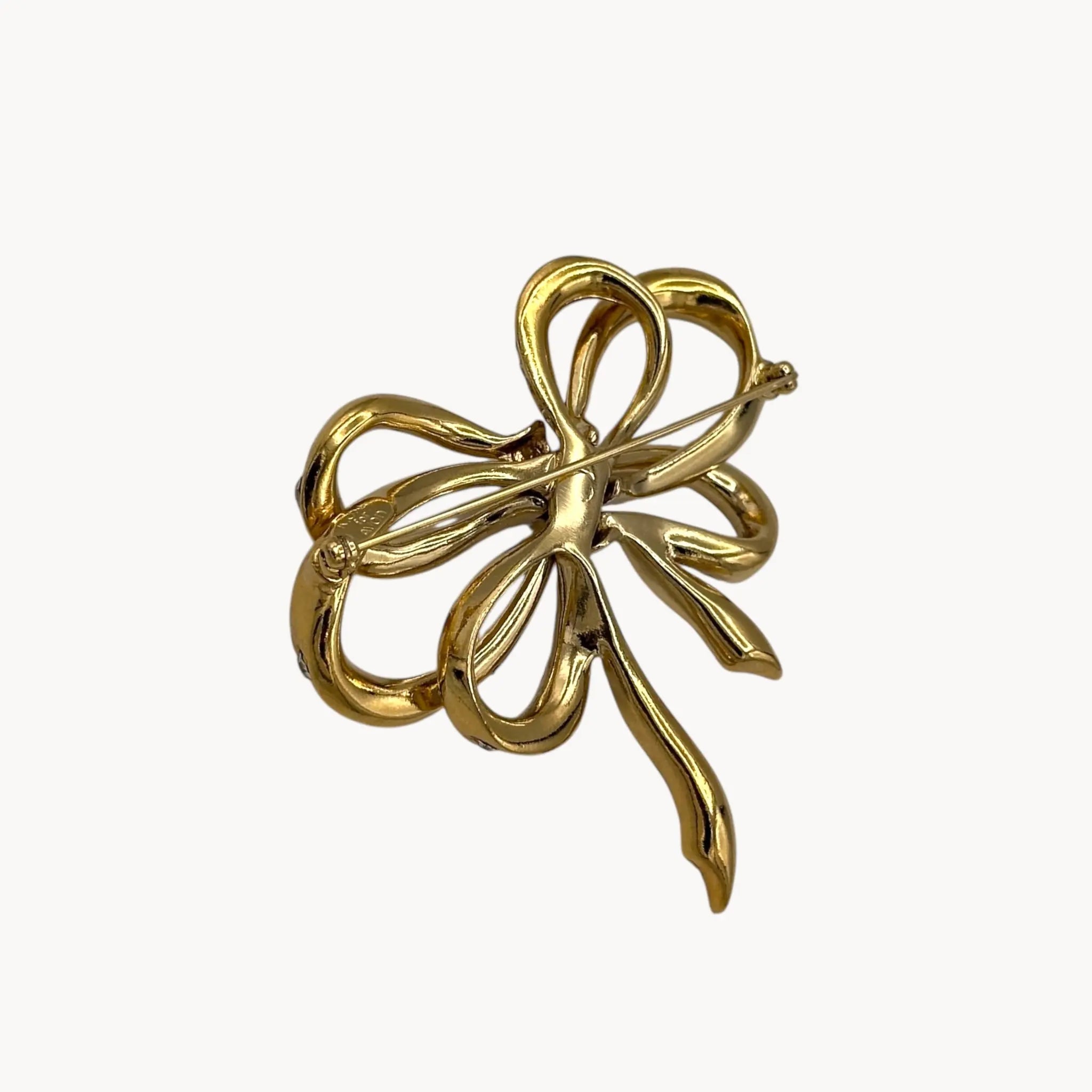 Back view Vintage Kenneth Jay Lane gold and crystal pavé bow brooch