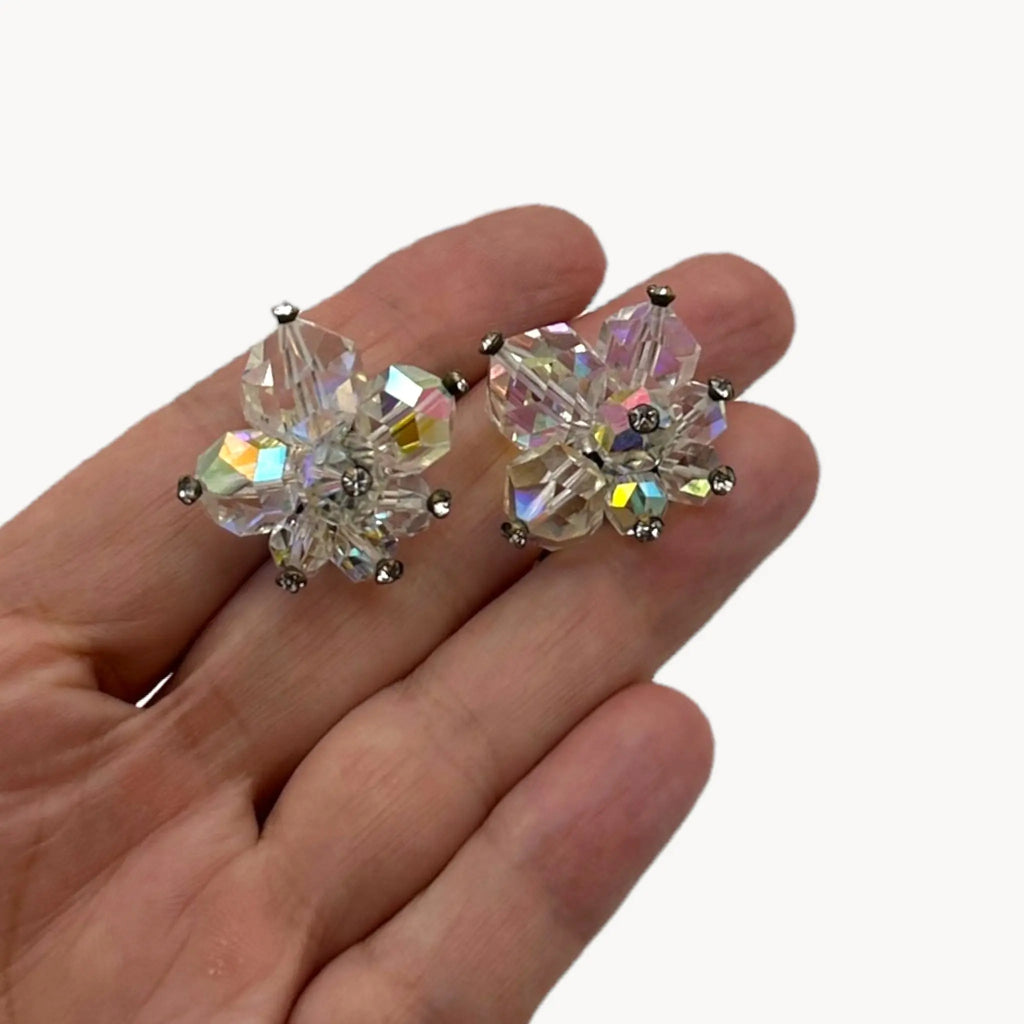 Scale size view 1950s Laguna crystal cluster clip-on earrings with aurora borealis finish, vintage bridal jewelry