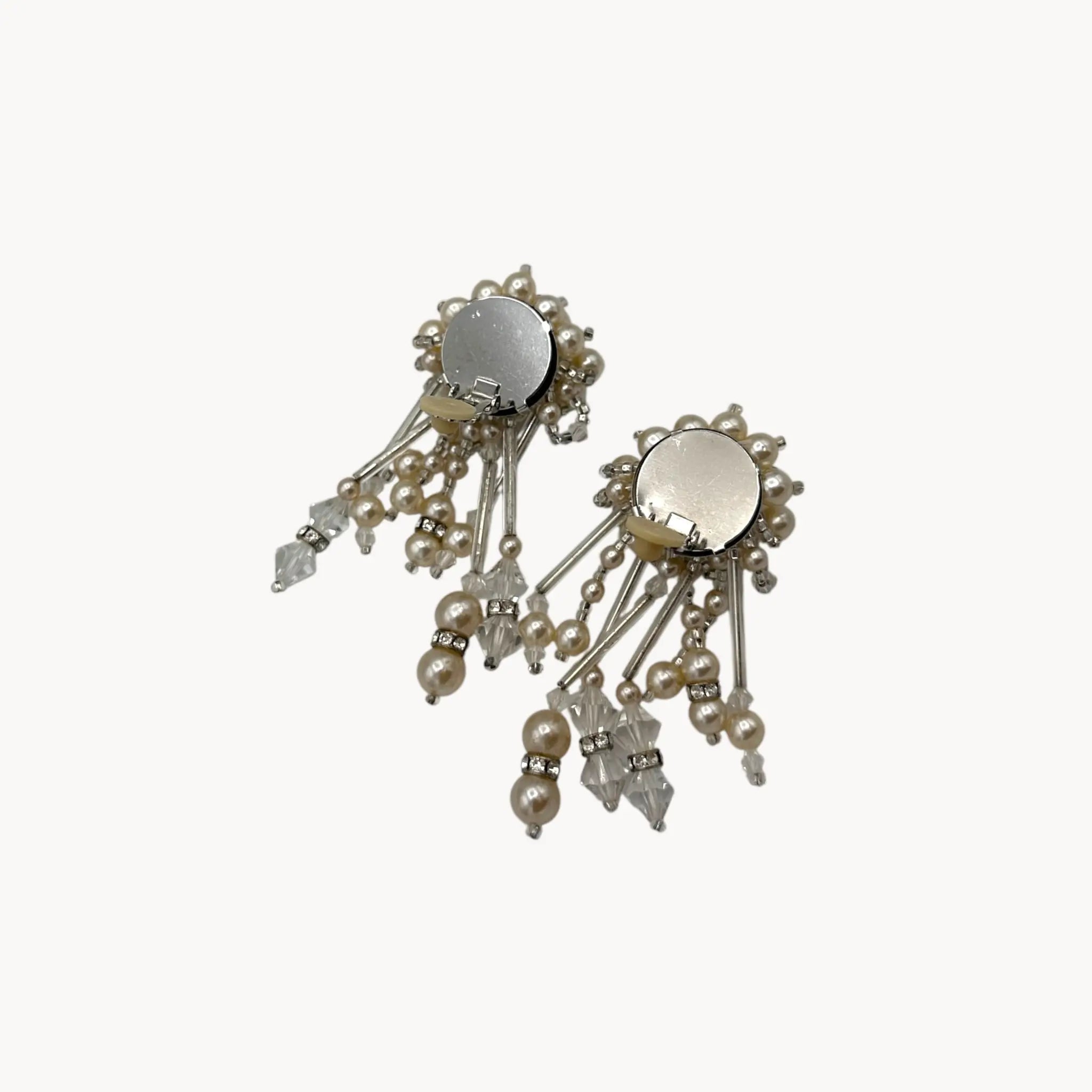 Back view with clips up of Vintage Lois Ann Pearl & Crystal Beaded Cascade Clip-On Earrings on white background.
