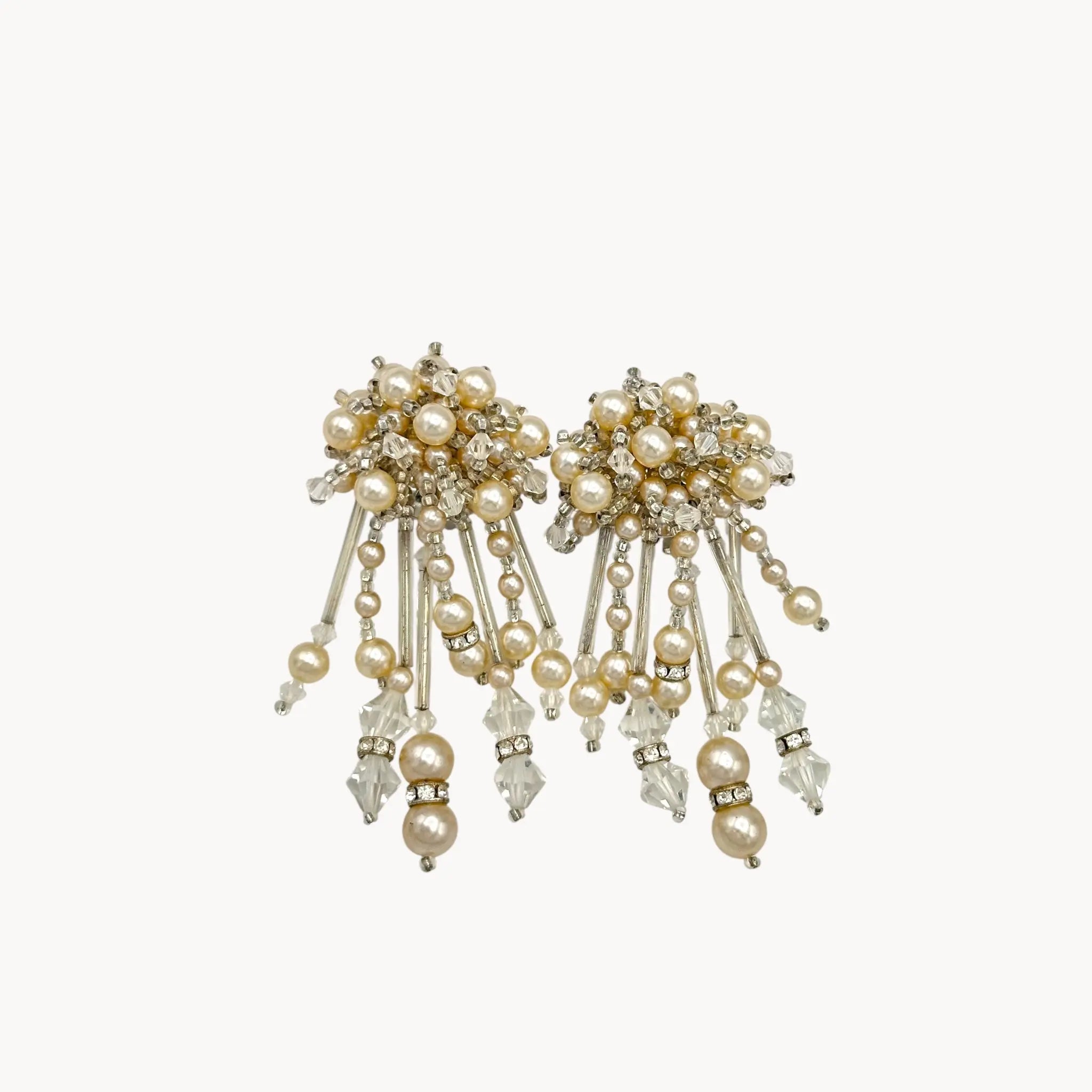 Close up view of Vintage Lois Ann Pearl & Crystal Beaded Cascade Clip-On Earrings on white background.