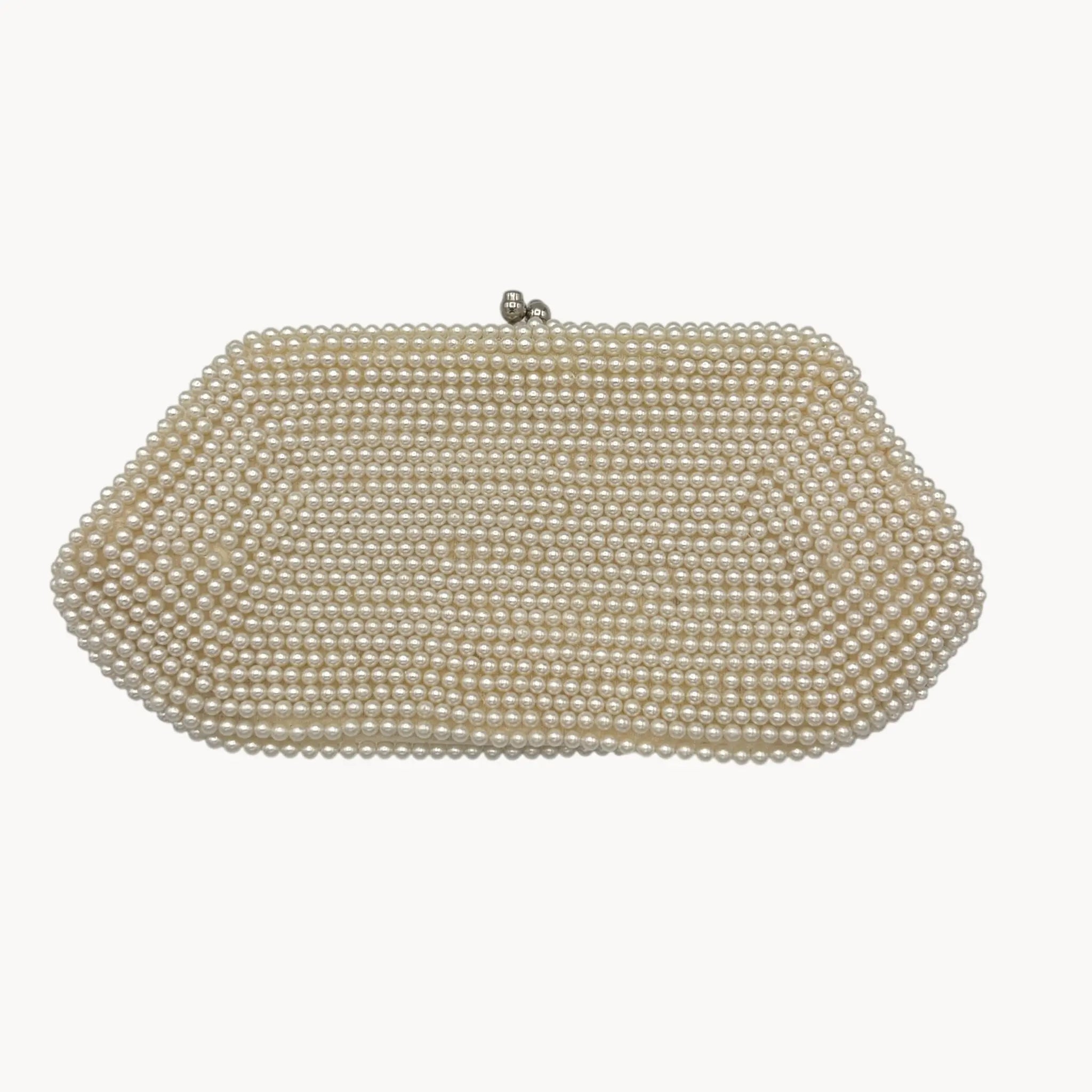 Back view of Vintage Made in Japan small pearl beaded clutch handbag, 1950 bridal purse on white background.
