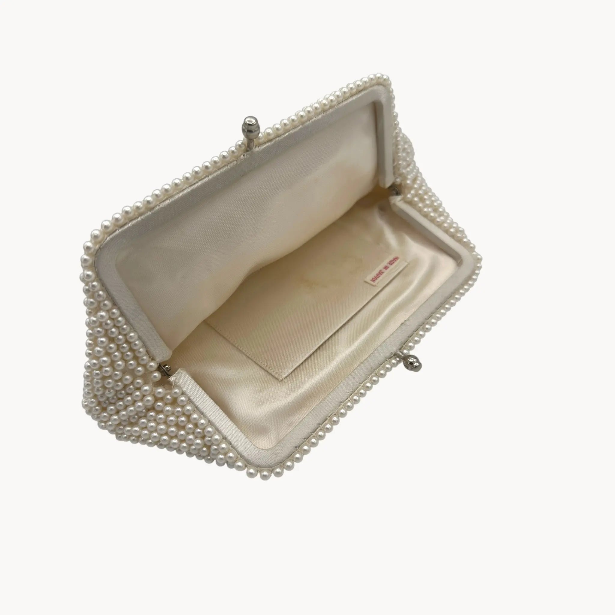 Open view of Vintage Made in Japan small pearl beaded clutch handbag, 1950 bridal purse on white background.