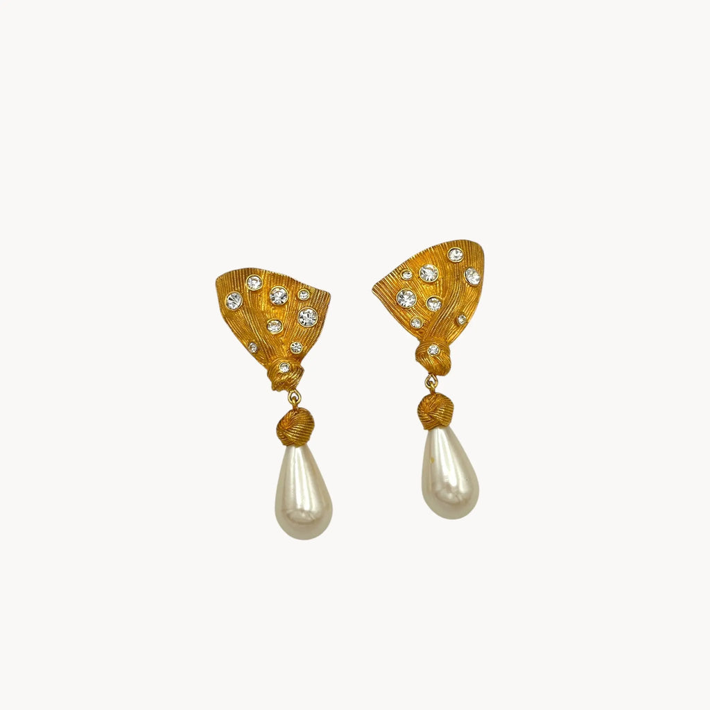 close up Vintage Marvella clip-on earrings with gold fan-shaped tops, crystal accents, and faux pearl drops, 1980s bridal jewelry.