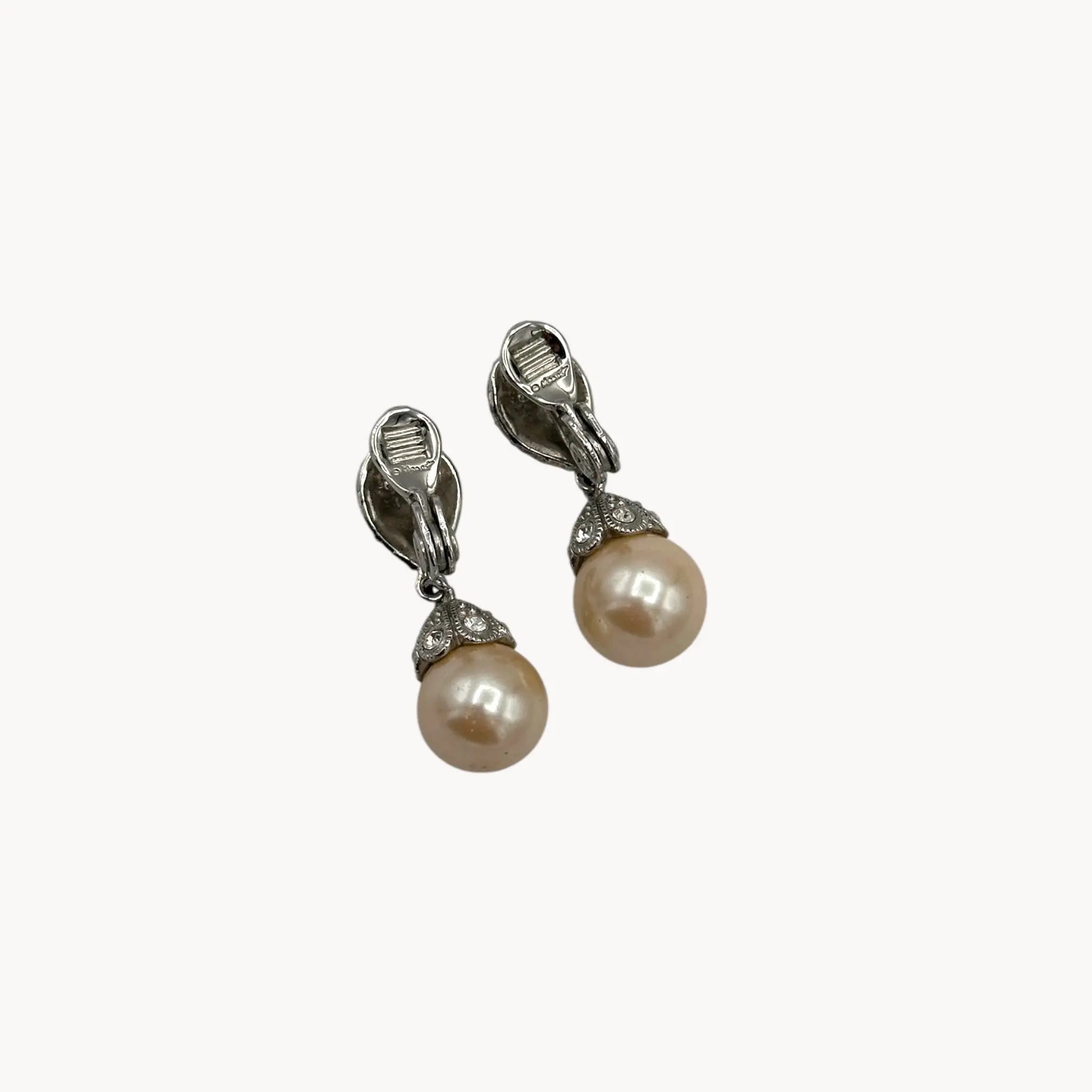 Back view Vintage Monet clip-on earrings with faux pearls and pavé crystal accents, 1980s–1990s bridal jewelry.