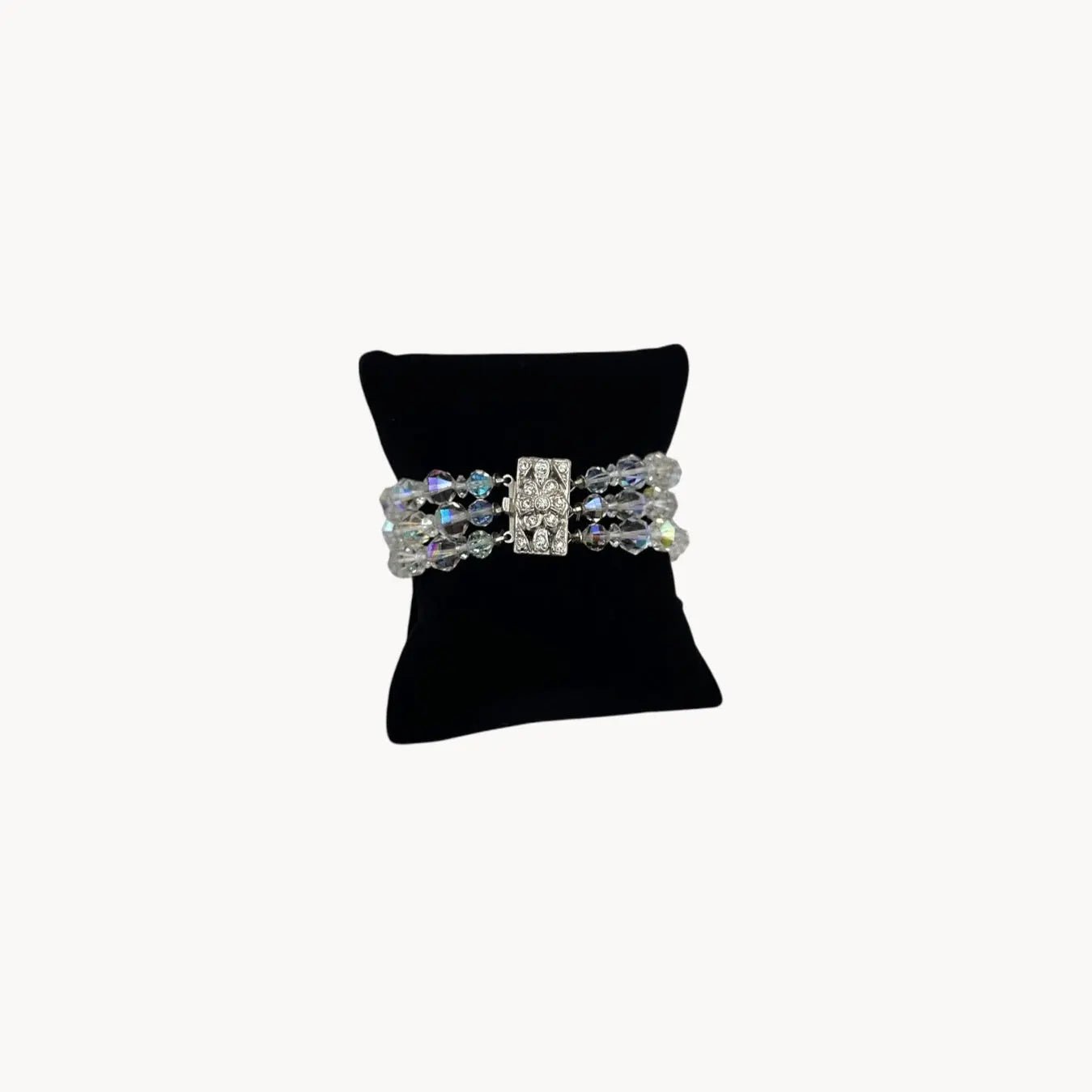Front view of Vintage unsigned multi-strand faceted crystal bracelet with rhinestone clasp in Art Deco style.