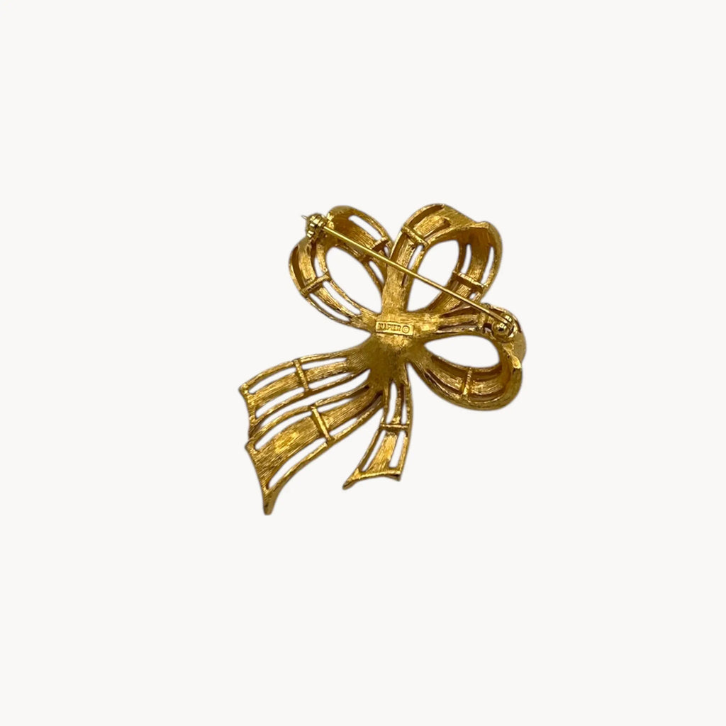 Back view of Vintage Napier gold ribbon bow brooch with pearl center.