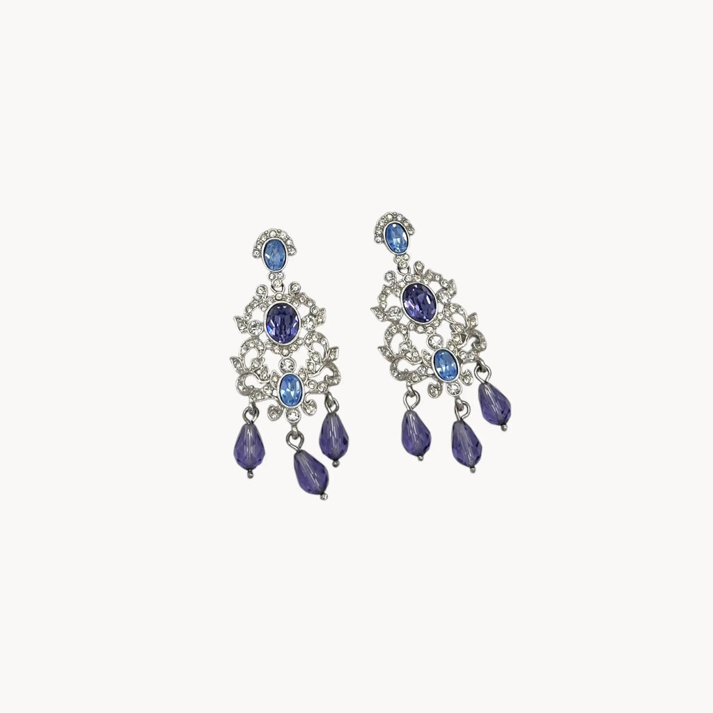 Close up view Vintage Nolan Miller blue crystal dangle pierced earrings with chandelier design