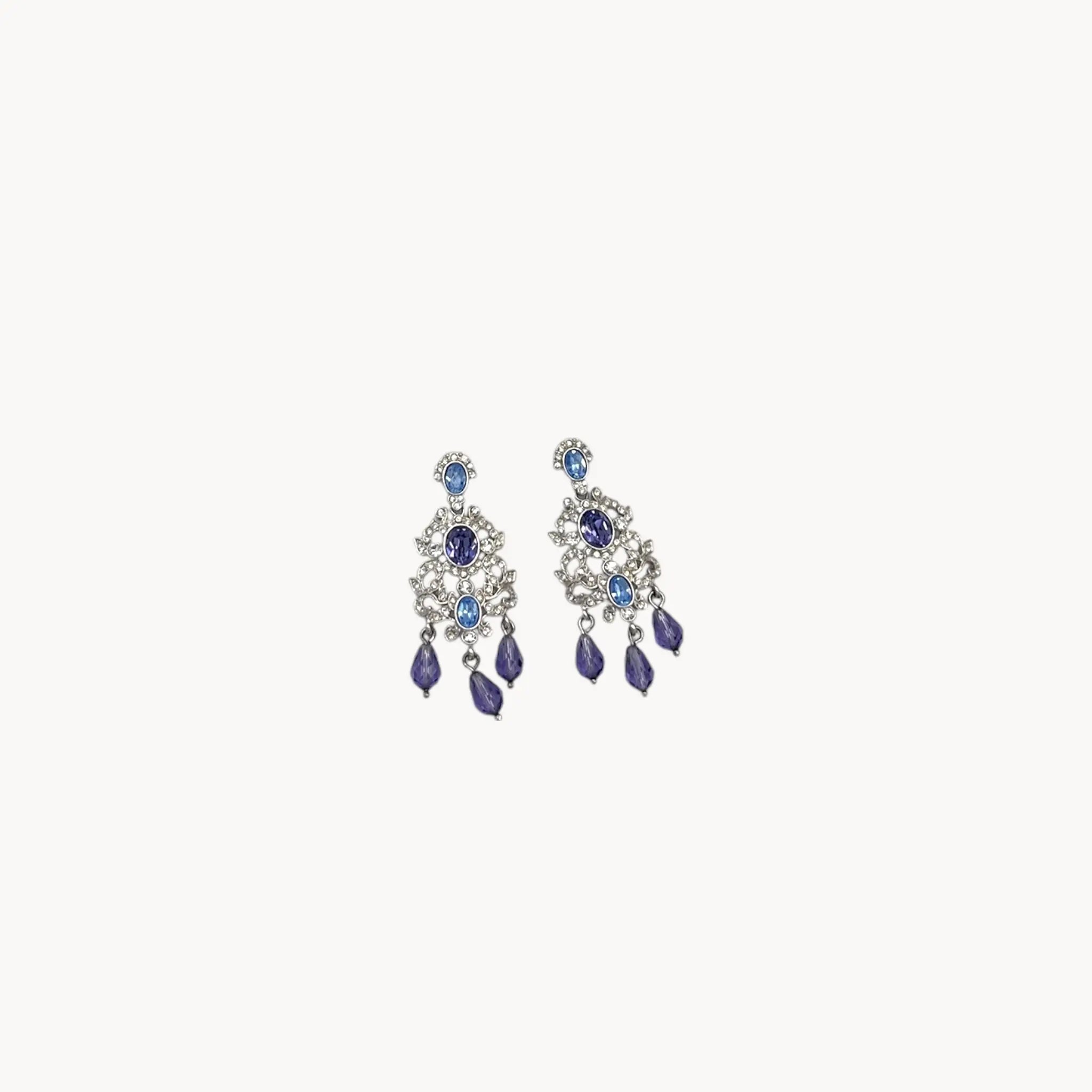Vintage Nolan Miller blue crystal dangle pierced earrings with chandelier design