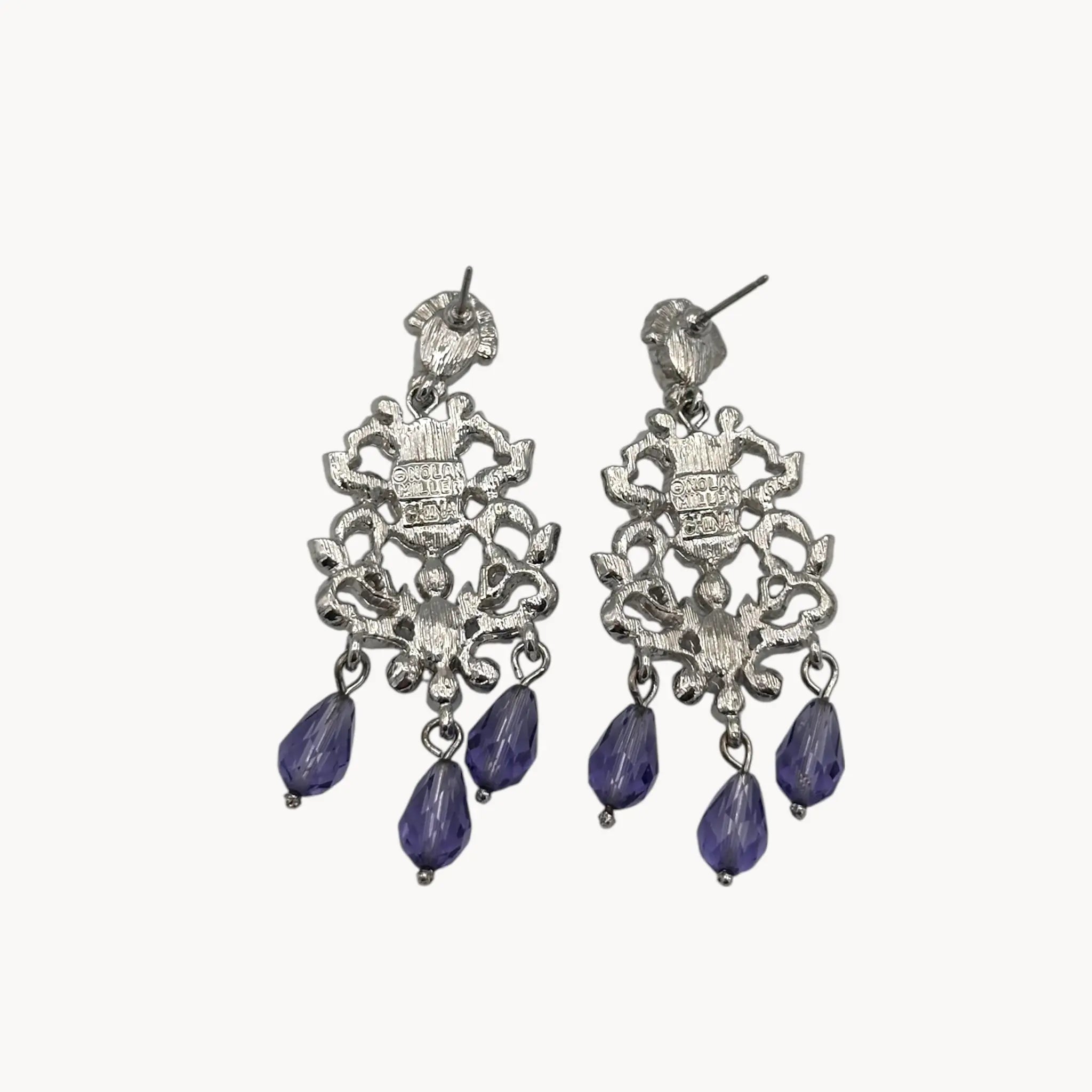 Back view of Vintage Nolan Miller blue crystal dangle pierced earrings with chandelier design