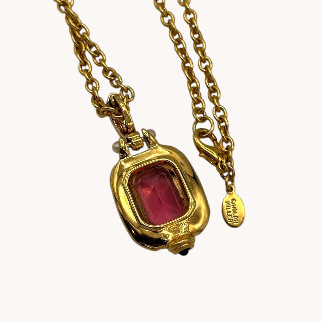 Back view of Vintage Nolan Miller long gold chain necklace with pink crystal pendant and clear crystal accents, 1980s–1990s bridal jewelry shown on white background.