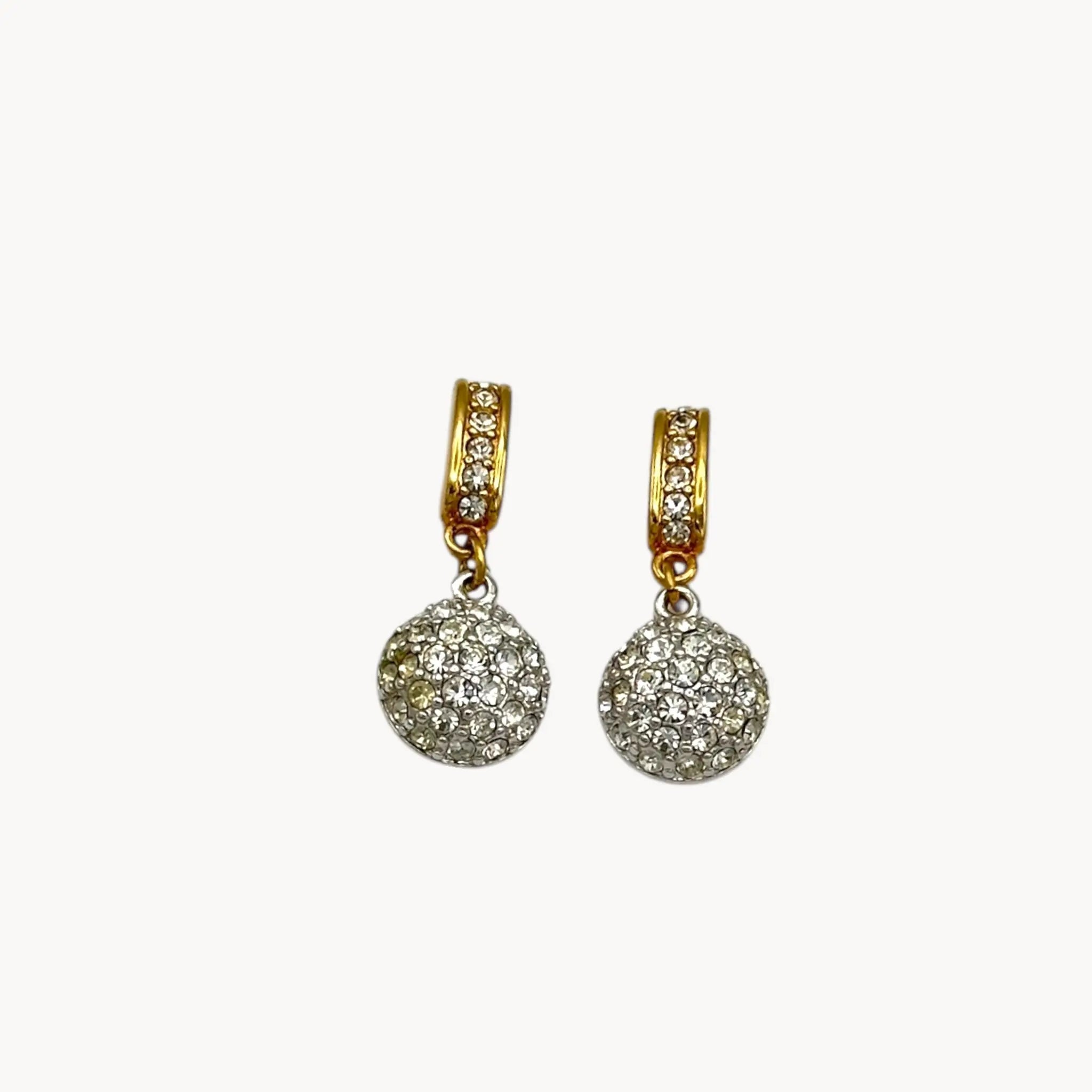 Close up of vintage Swarovski gold and crystal pavé dangle earrings with hoop top and round drop, vintage bridal jewelry.
