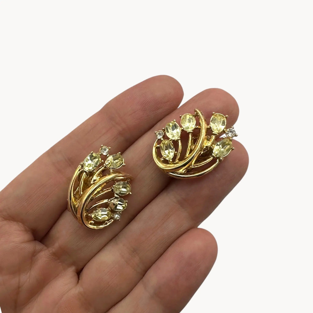 Earring size Vintage Trifari bracelet and clip-on earring set with peridot green marquise rhinestones and clear crystal accents, 1950s–1960s jewelry.