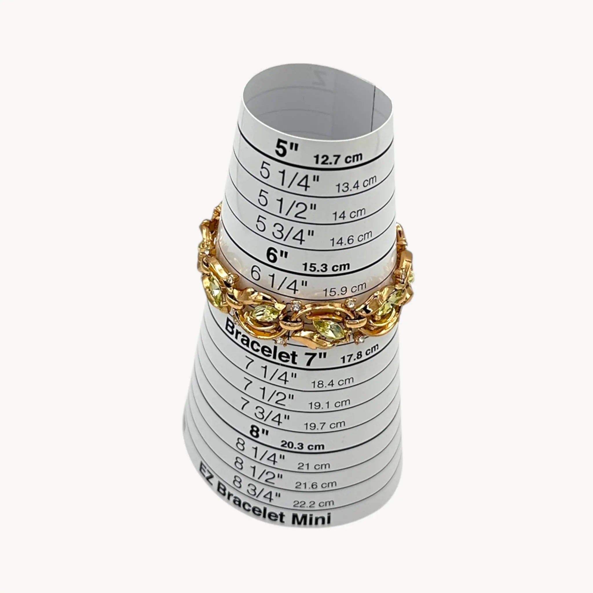 size of bracelet Vintage Trifari bracelet and clip-on earring set with peridot green marquise rhinestones and clear crystal accents, 1950s–1960s jewelry.