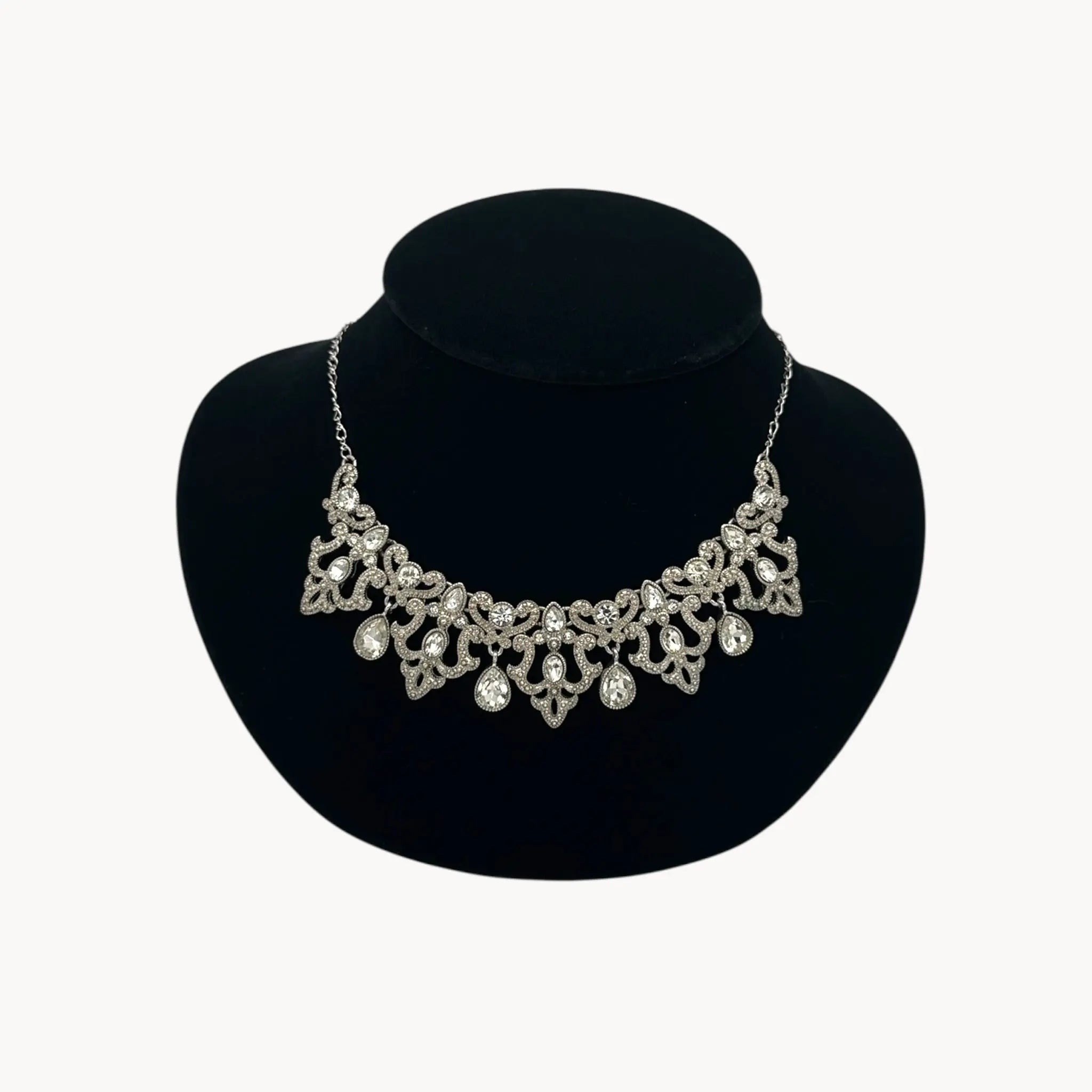 Close up view of Vintage 1990s Trifari rhinestone statement necklace with teardrop accents